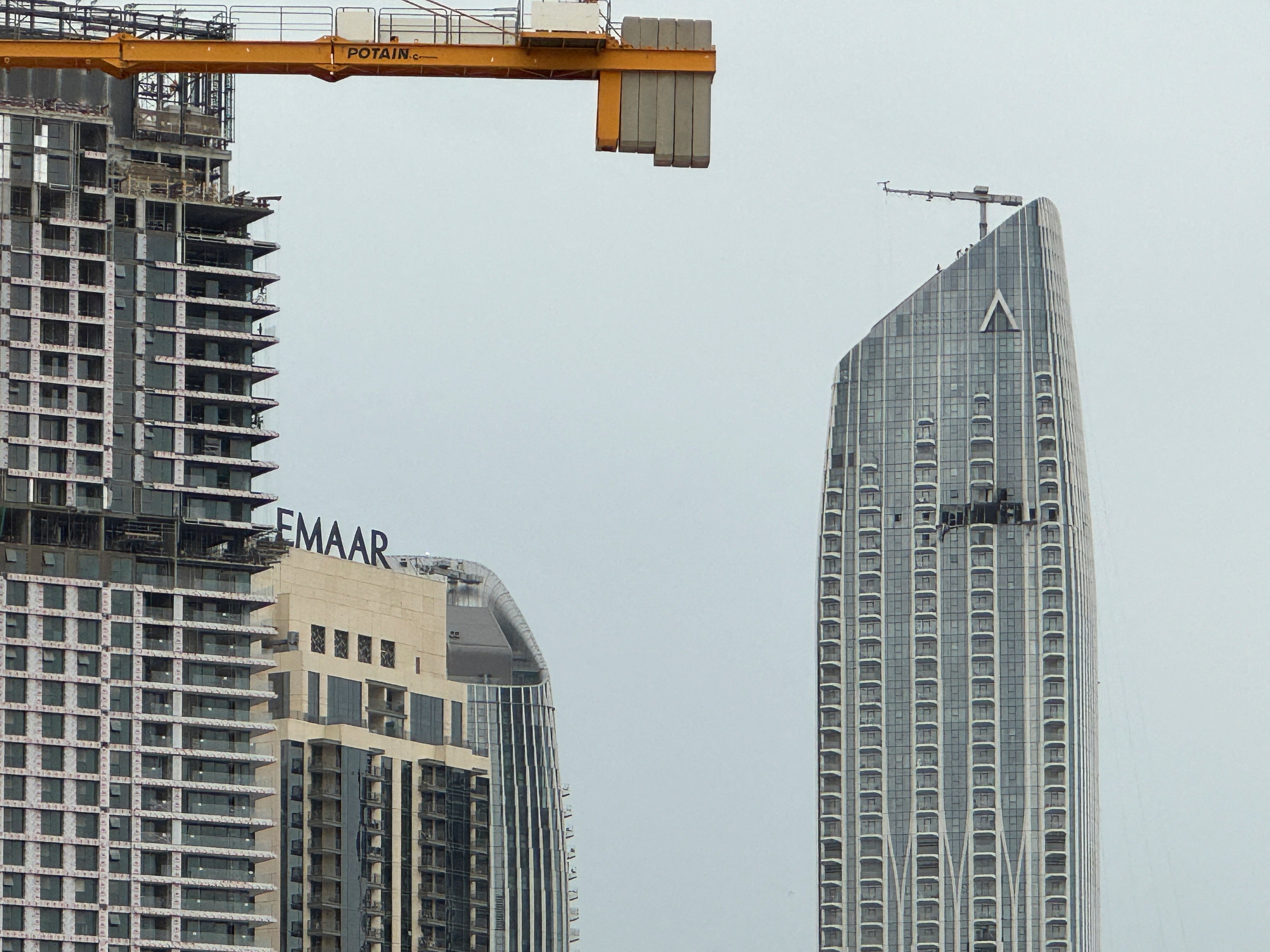 A damaged building in the vicinity of Dubai Creek Harbour after a drone fell on it, amid the U.S.-Israeli conflict with Iran, in Dubai, United Arab Emirates, March 12, 2026. Picture taken with a mobile phone. REUTERS/Stringer