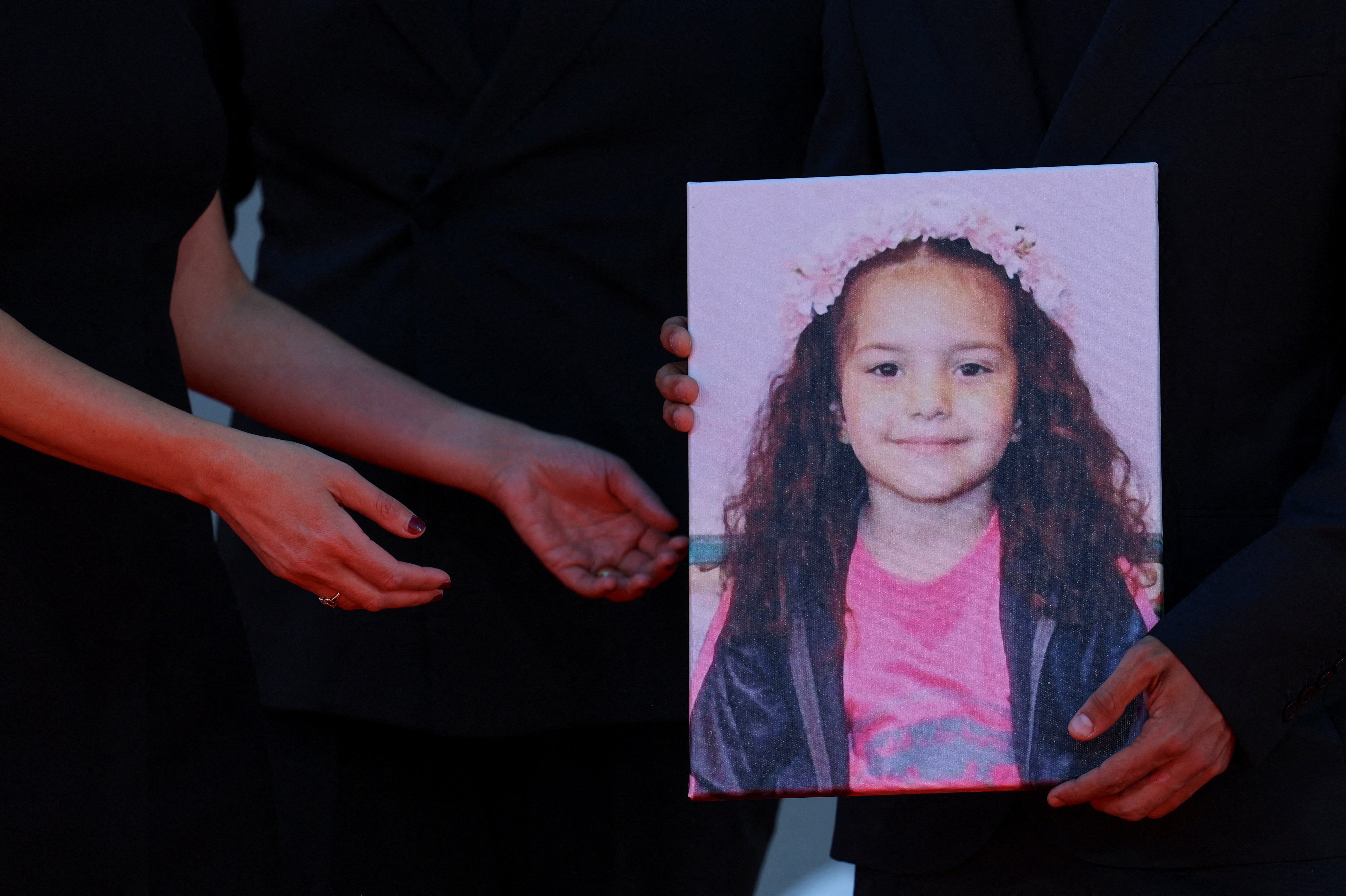A picture of Hind Rajab is held on the red carpet during arrivals for the screening "The Voice of Hind Rajab" in competition, at the 82nd Venice Film Festival, Venice, Italy, September 3, 2025. REUTERS/Yara Nardi