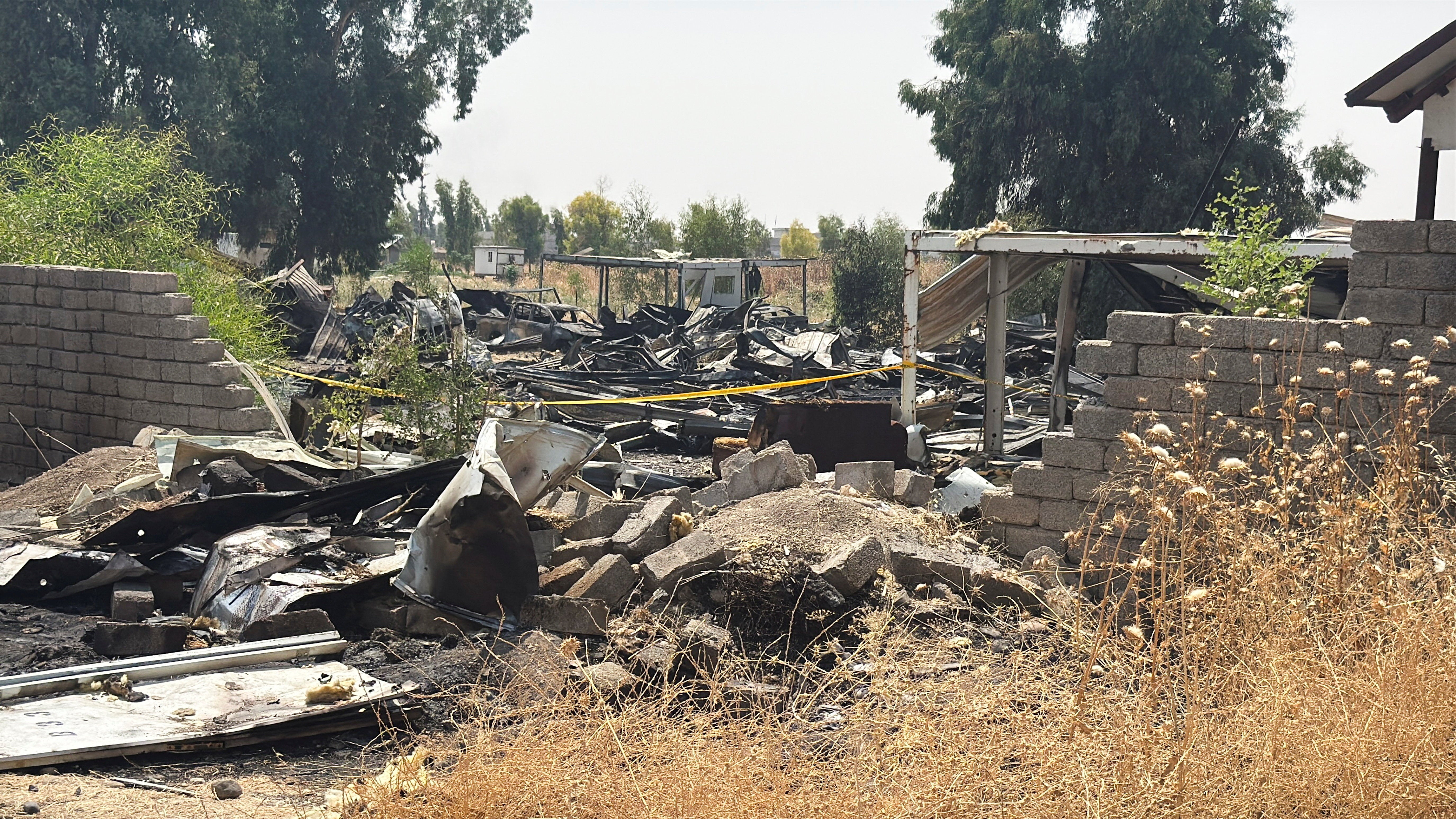 Damage at a site belonging to Iraq's Popular Mobilization Forces (PMF) following airstrikes that the PMF said were carried out by U.S. and Saudi forces, in Bartella, Nineveh province, Iraq, July 29, 2026. Picture taken with a mobile phone.