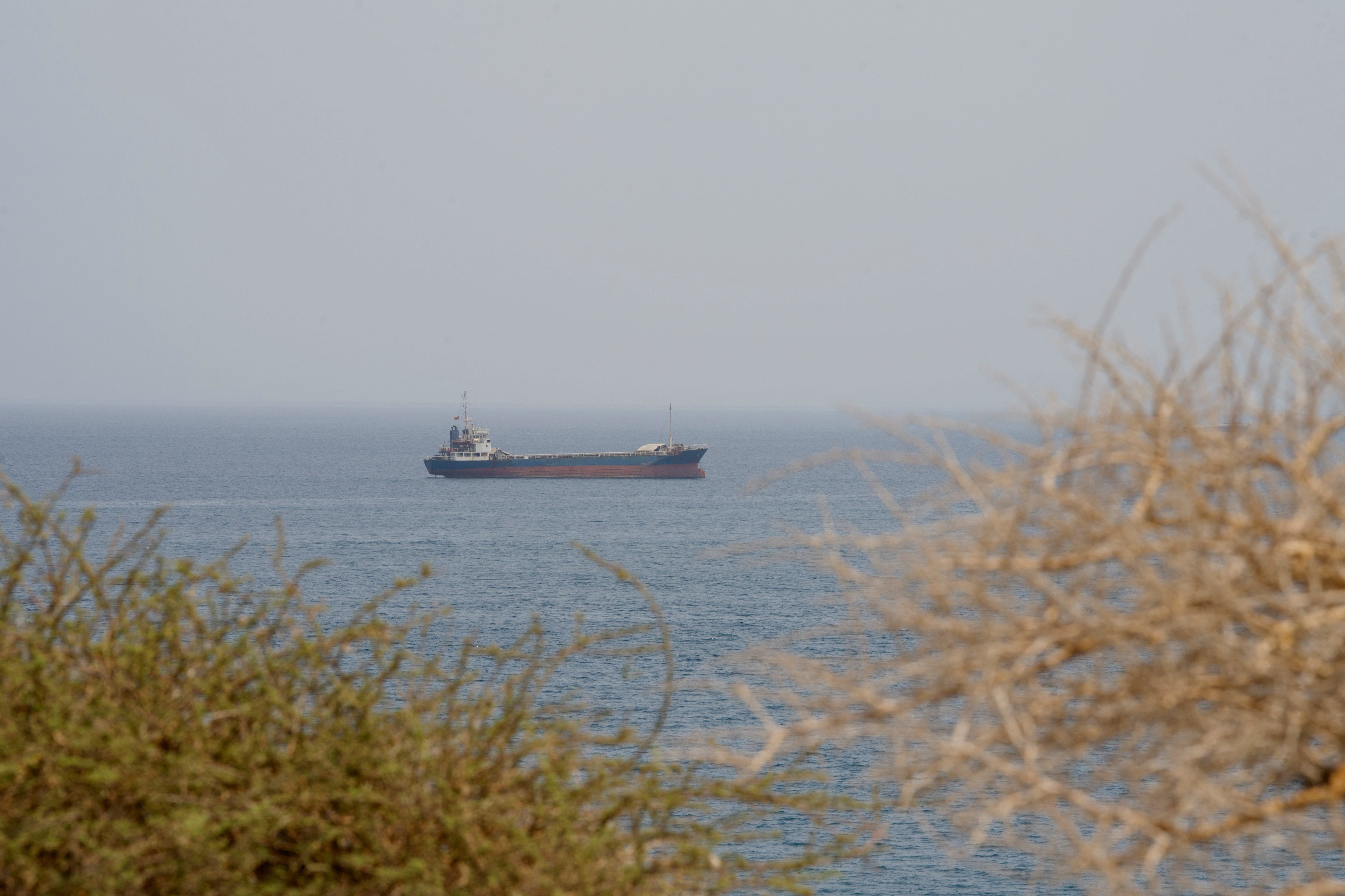 A vessel near the Strait of Hormuz, as seen from Musandam, Oman, August 10, 2026. REUTERS/Stringer
