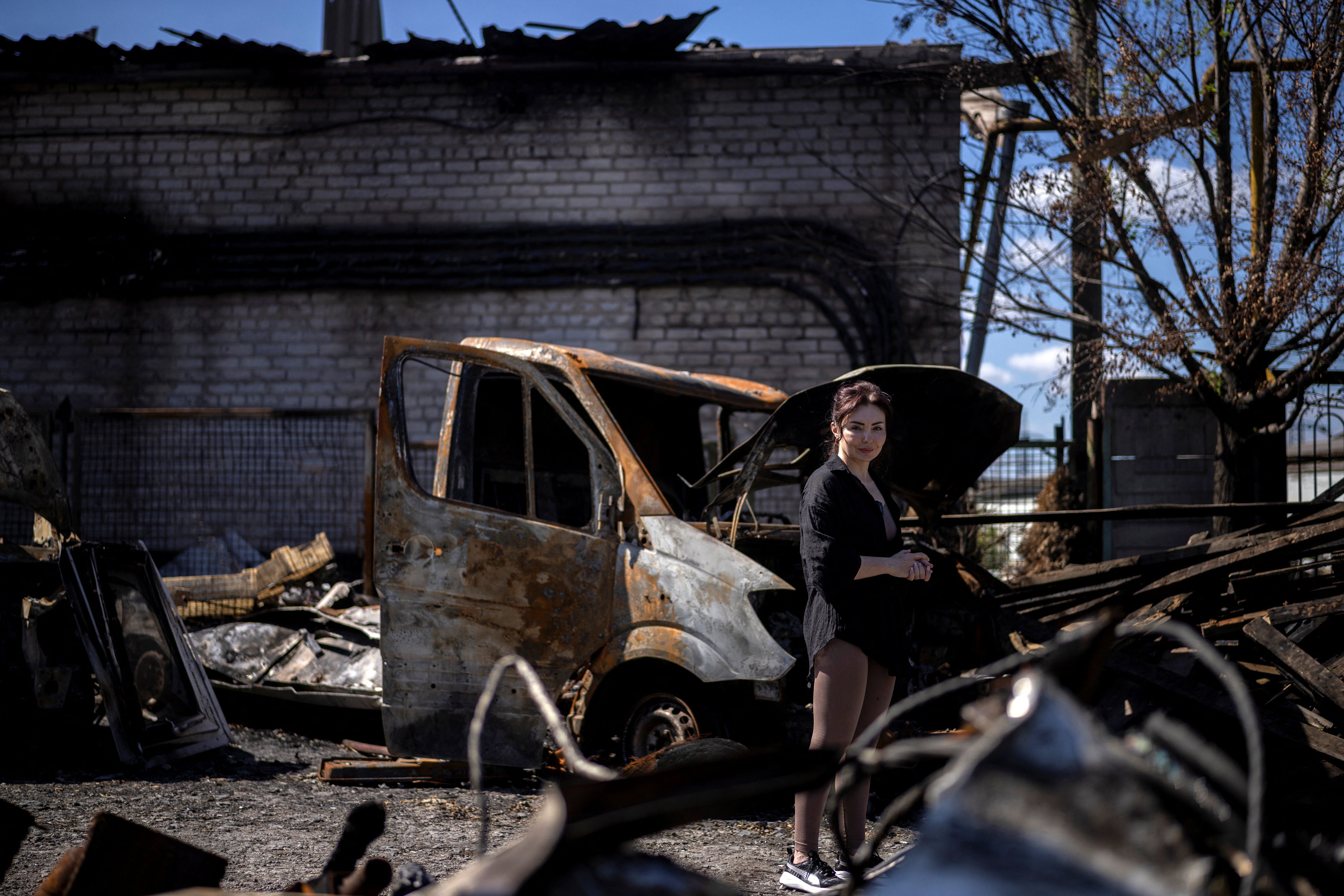 Kateryna Lahuta stands in the courtyard of her seafood business that went up in flames during a recent Russian strike, amid Russia’s attack on Ukraine, in Zaporizhzhia, Ukraine, July 30, 2026. REUTERS/Thomas Peter