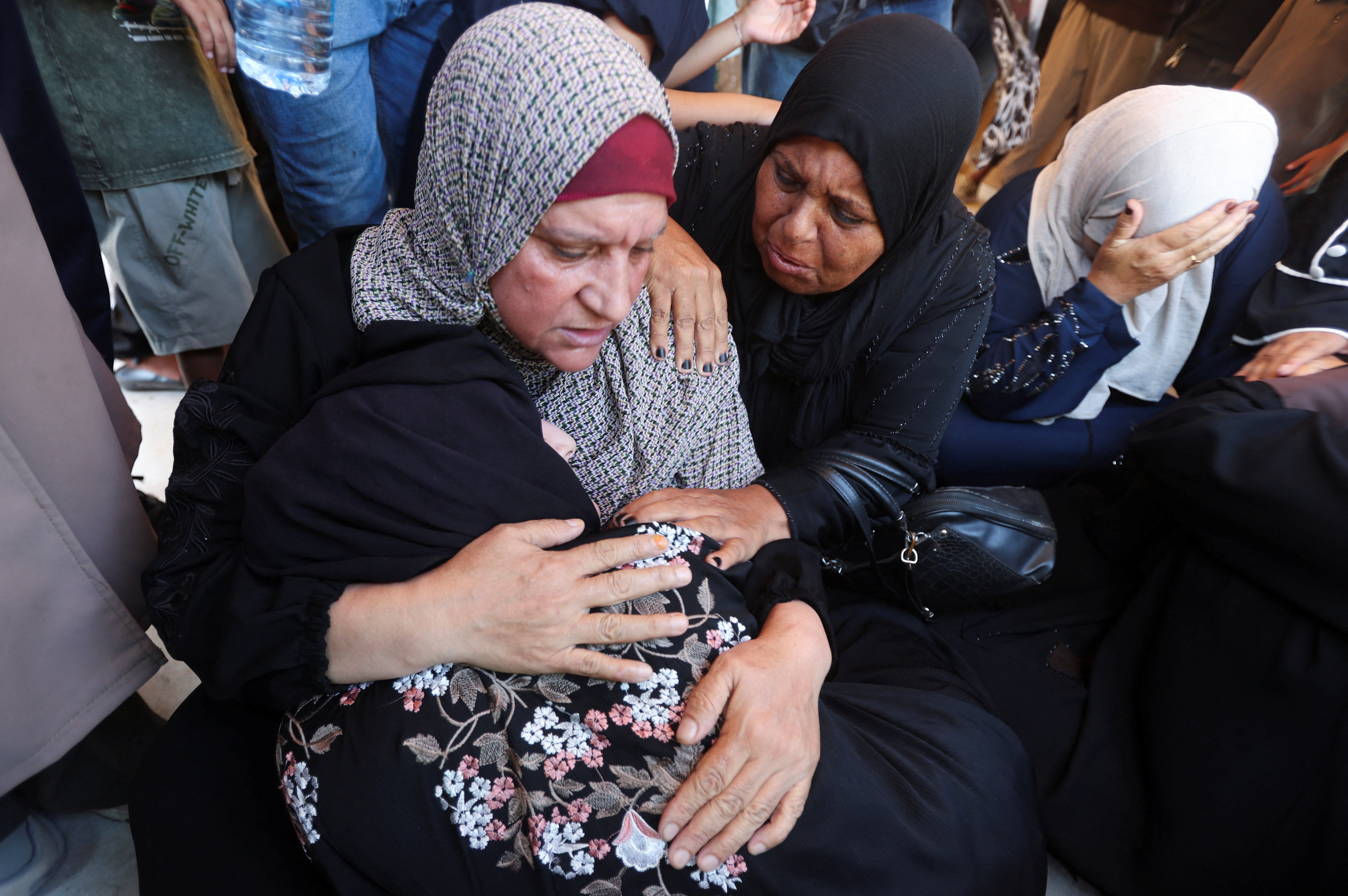 Mourners react at the funeral of a Palestinian man Huthaifa Kawari, who was killed in an Israeli strike, according to medics, at Nasser Hospital in Khan Younis, in the southern Gaza Strip, August 13, 2026. REUTERS/Ramadan Abed