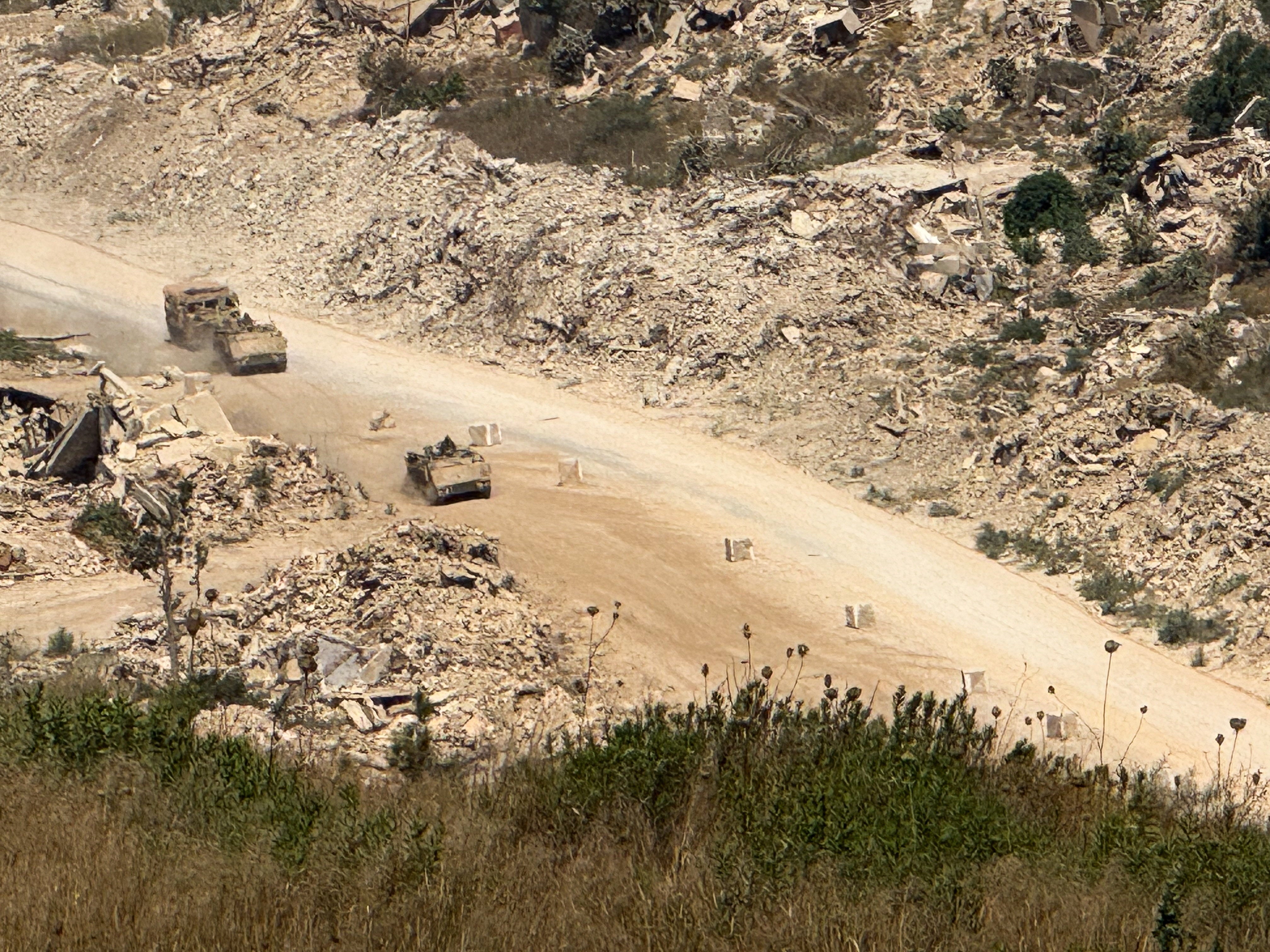 Israeli vehicles drive on a road in southern Lebanon, as seen from the Israeli side of the Israel-Lebanon border, in northern Israel, August 6, 2026. Picture taken with a mobile phone. REUTERS/Avi Ohayon