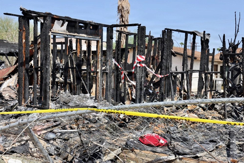A Twentynine Palms home shows extensive damage Aug. 24, 2026, following an Aug. 21 explosion and fire. Off-duty Navy corpsmen and Marines rushed to the scene, helped rescue injured residents and evacuated nearby homes.

Credit: U.S. Navy photo by
