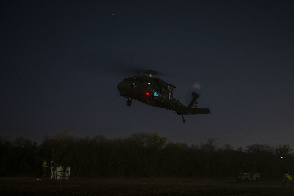 Texas Army National Guard Soldiers along with other units participate in a night helicopter rigging mission