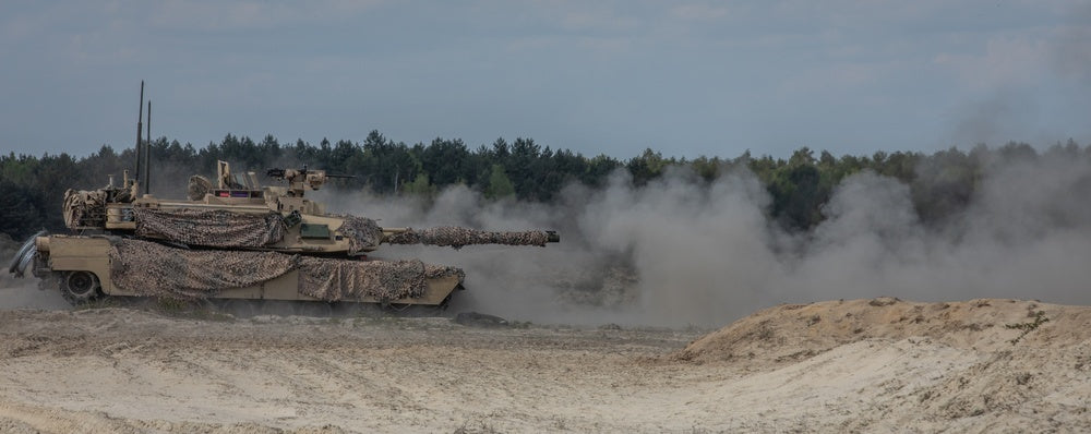 U.S. soldiers fire the main gun of an M1A2 Abrams tank during training in preparation for Anakonda23
