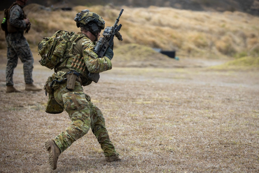 An Australian Army Soldier assigned to Charlie Company, 1st Battalion, Royal Australian Regiment, conducts a live fire exercise during Rim of the Pacific