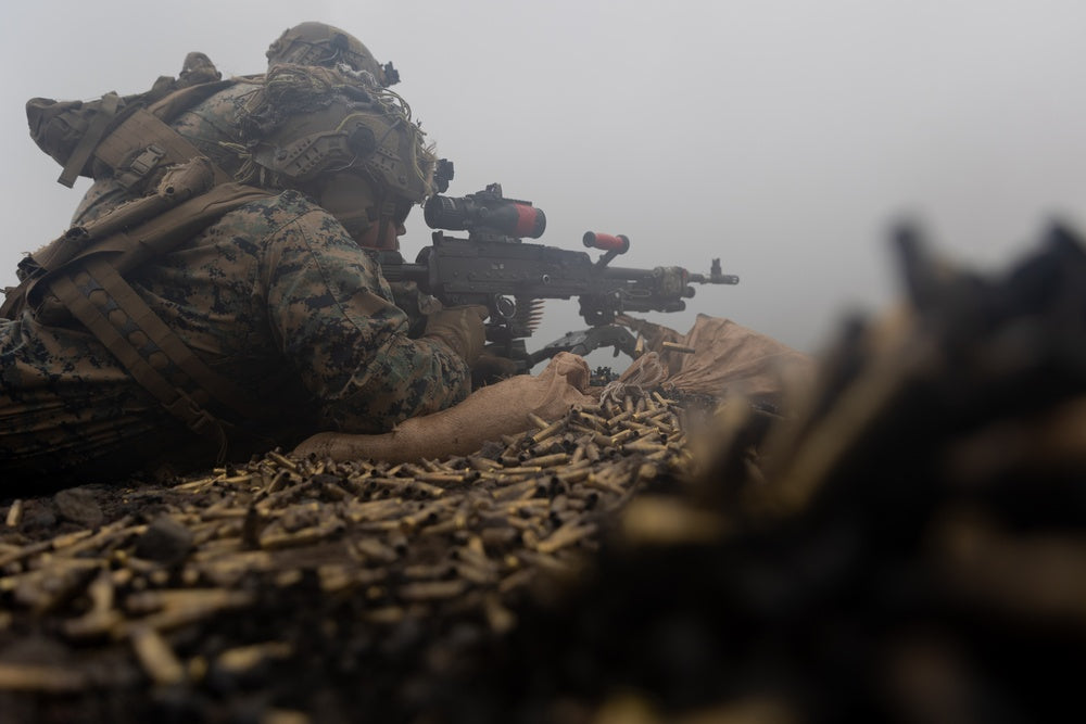 U.S. Marine Corps Sgt. Wyatt Cornish fires an M240B machine gun during a live-fire range at Combined Arms Training Center Camp