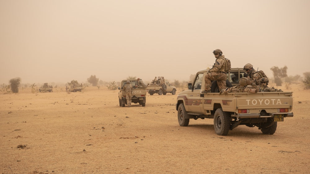 German Bundeswehr soldiers prepare to dismount from their vehicle during a mounted and dismounted patrol scenario