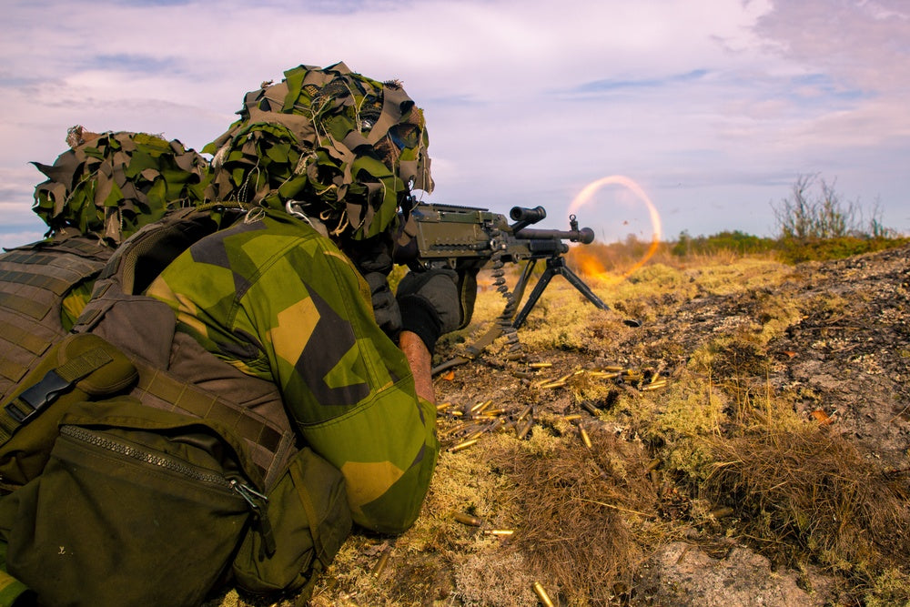 A Swedish marine shoots at targets during Exercise Archipelago Endeavor along with U.S. Marines
