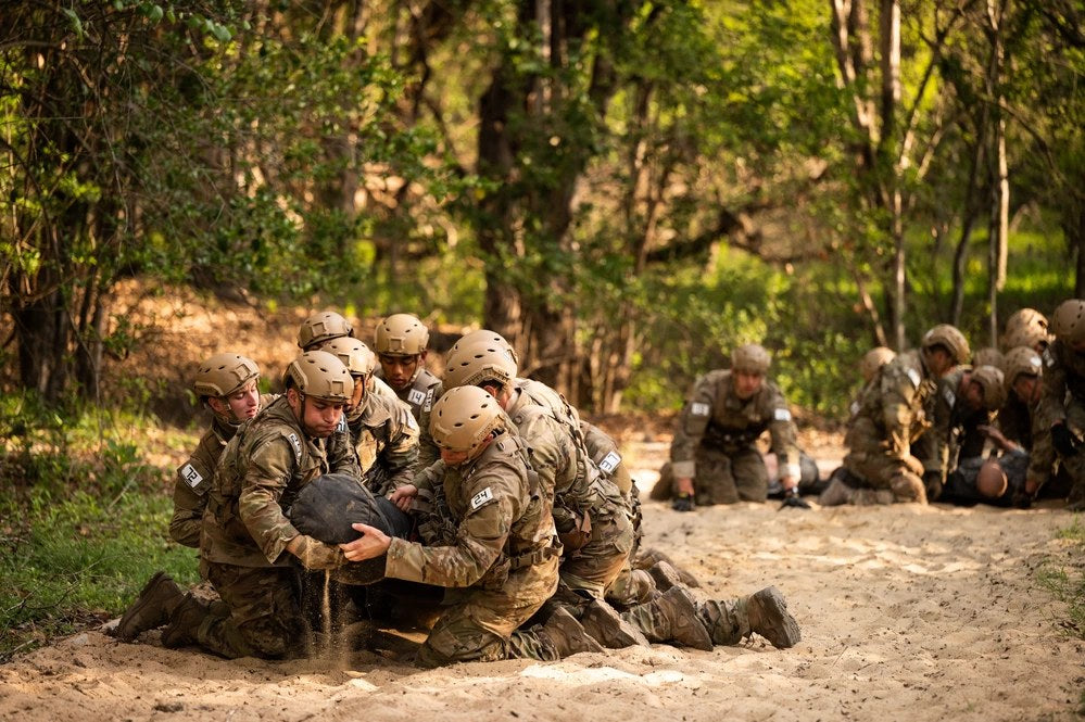 Air Force Special Warfare candidates maneuver an obstacle course during Assessment & Selection at Joint Base San Antonio-Lackland, Texas, March 14, 2023. U.S. Air Force photo by Miriam Thurber.
