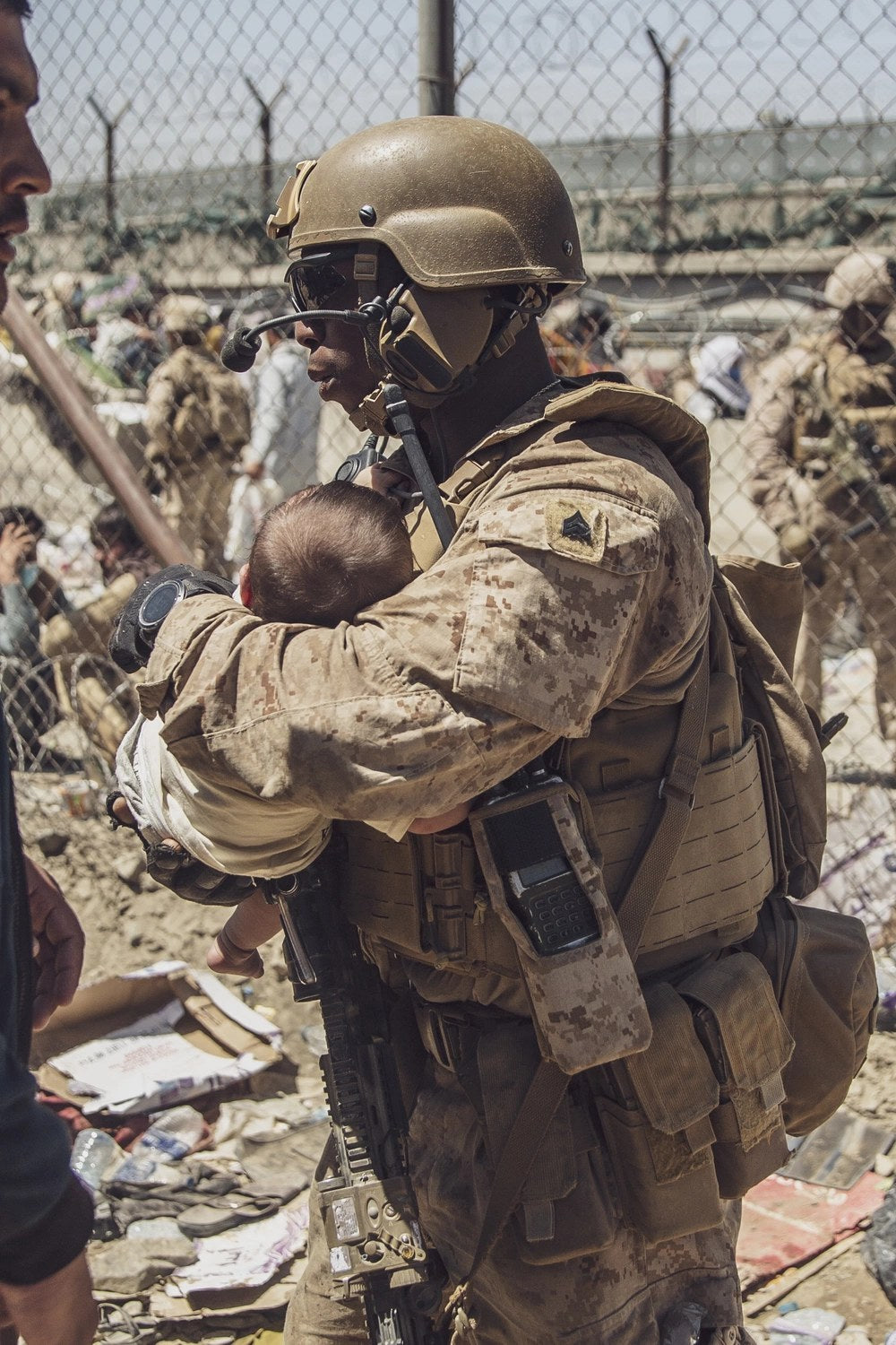 A U.S. Marine cares for an infant during evacuation operations at Hamid Karzai International Airport in Kabul, Afghanistan, Aug. 26, 2021, the day of the Abbey Gate bombing.

Credit: U.S. Marine Corps photo by Staff Sgt. Victor Mancilla
