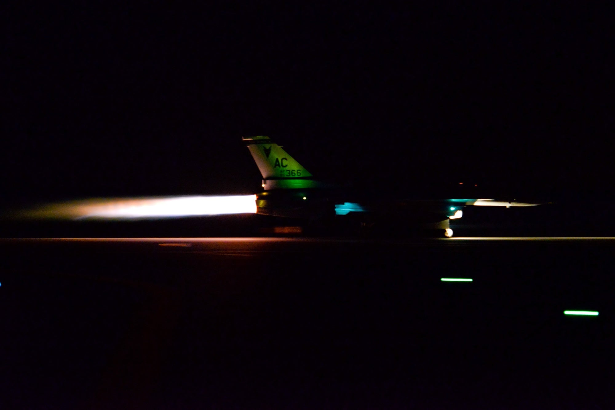 A U.S. Air Force F-16C Fighting Falcon from the 177th Fighter Wing of the New Jersey Air National Guard takes off in full afterburner from the Atlantic City Air National Guard base in Egg Harbor Township, N.J.,