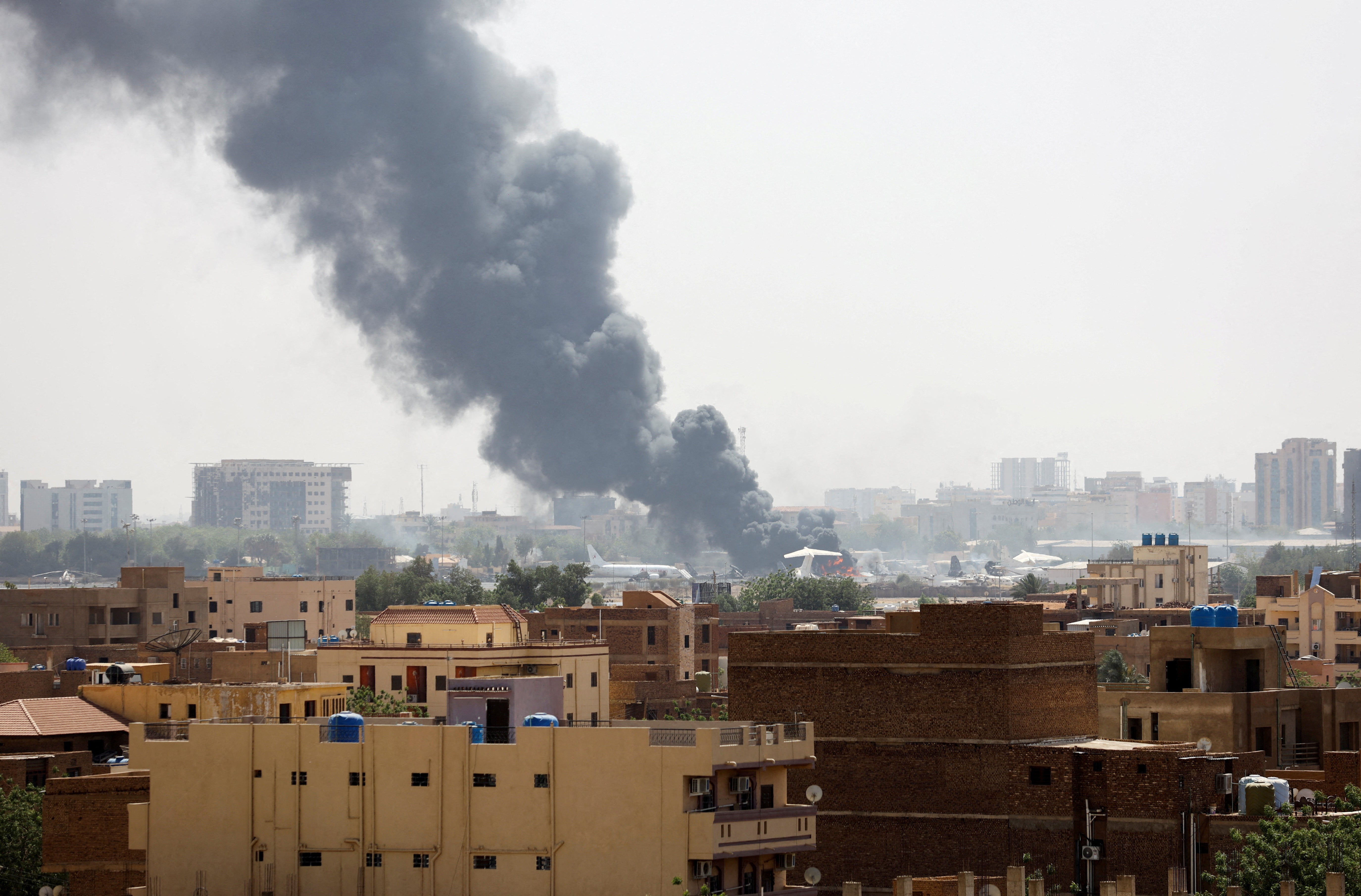 Smoke rises from burning aircraft inside Khartoum Airport during clashes between the paramilitary Rapid Support Forces and the army in Khartoum