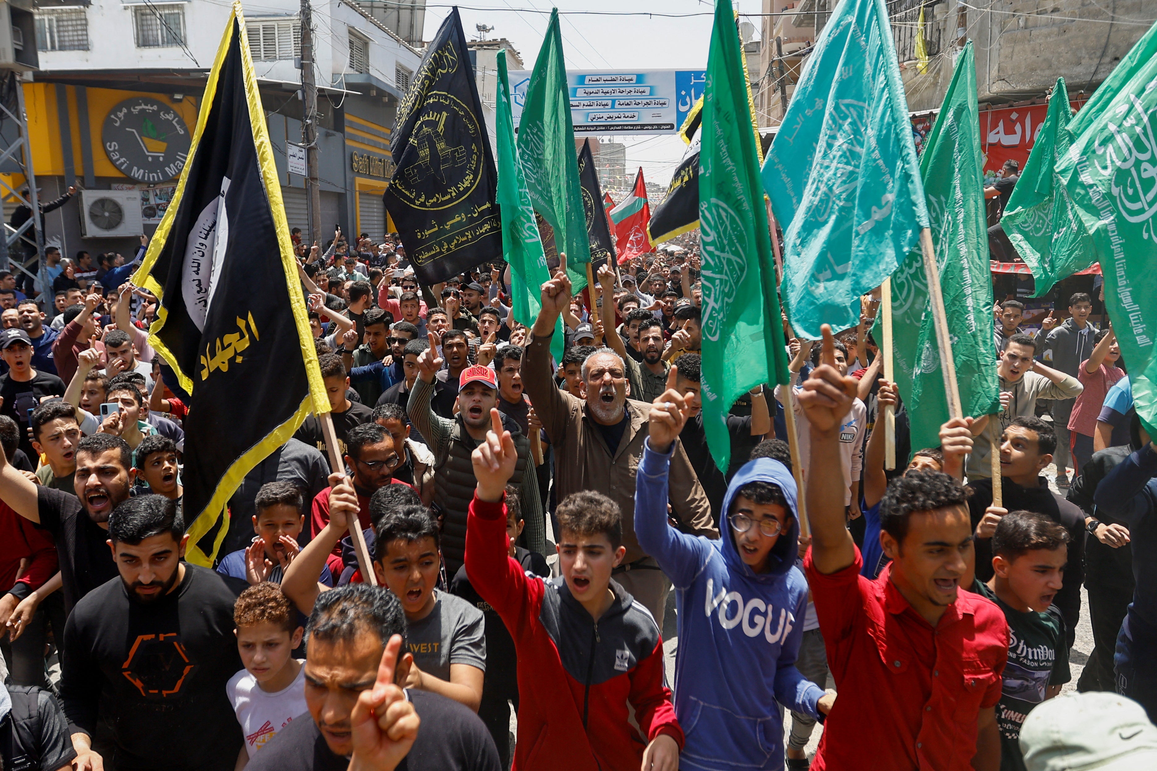 Mourners attend the funeral of Islamic Jihad commander Ali Ghali and his brother Mahmoud