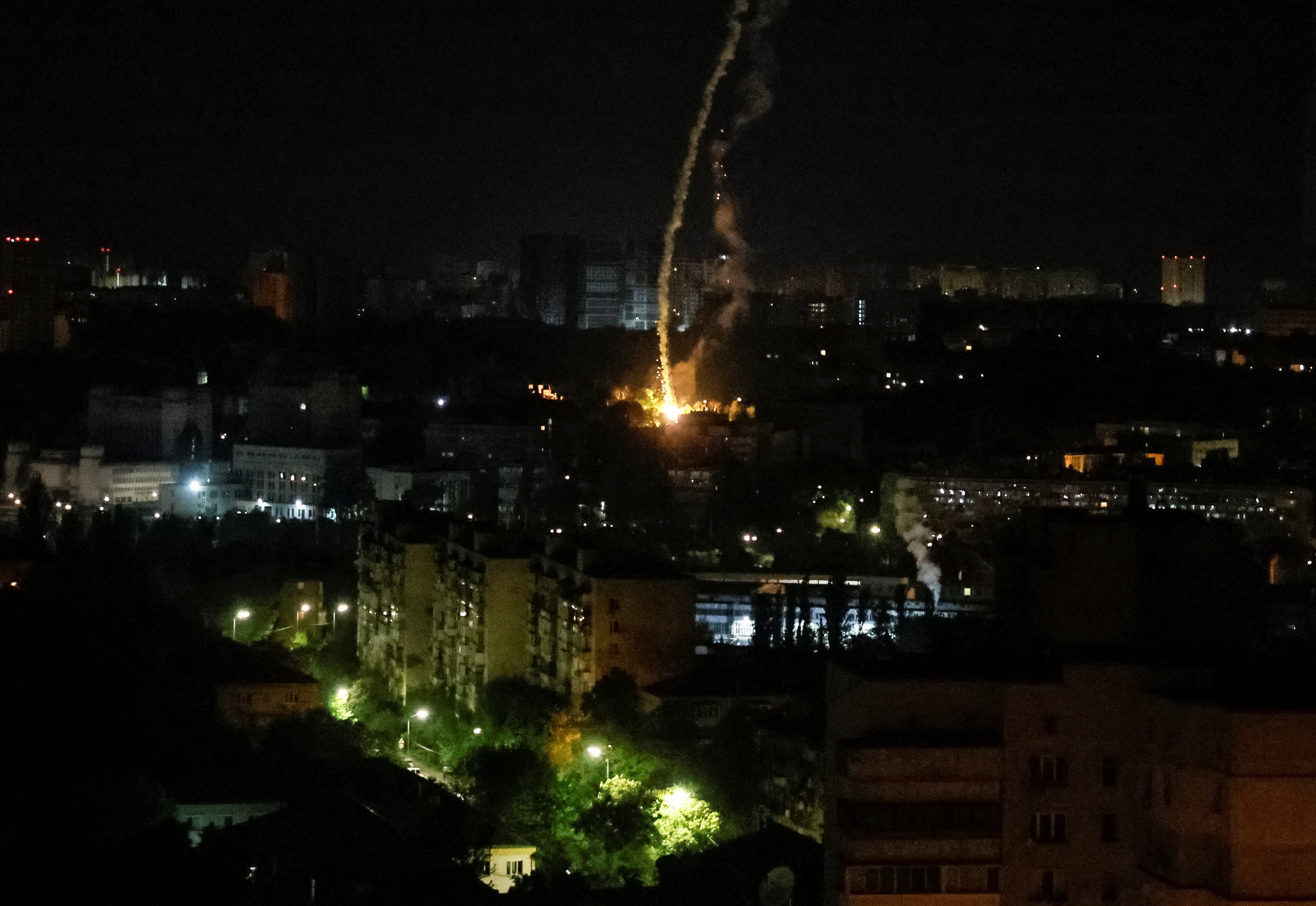 An explosion of a missile is seen in the city during a Russian missile strike, amid Russia's attack on Ukraine