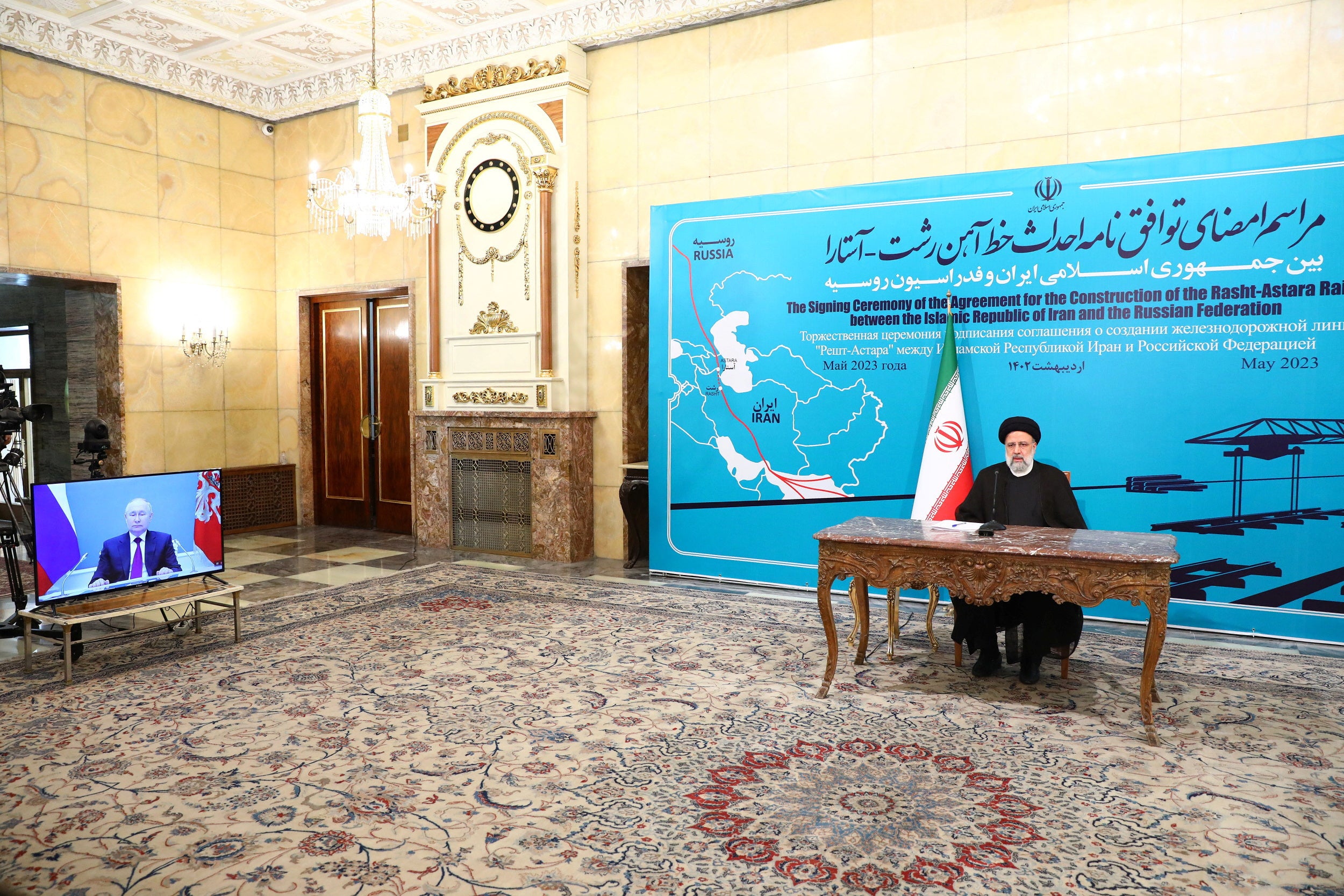 Iranian President Ebrahim Raisi, together with Russian President Vladimir Putin, takes part in the ceremony of signing an agreement on the construction of the Rasht-Astara railway