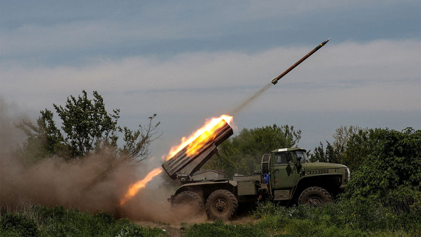 Ukrainian servicemen fire a BM-21 Grad multiple launch rocket system towards Russian troops near the frontline town of Bakhmut 