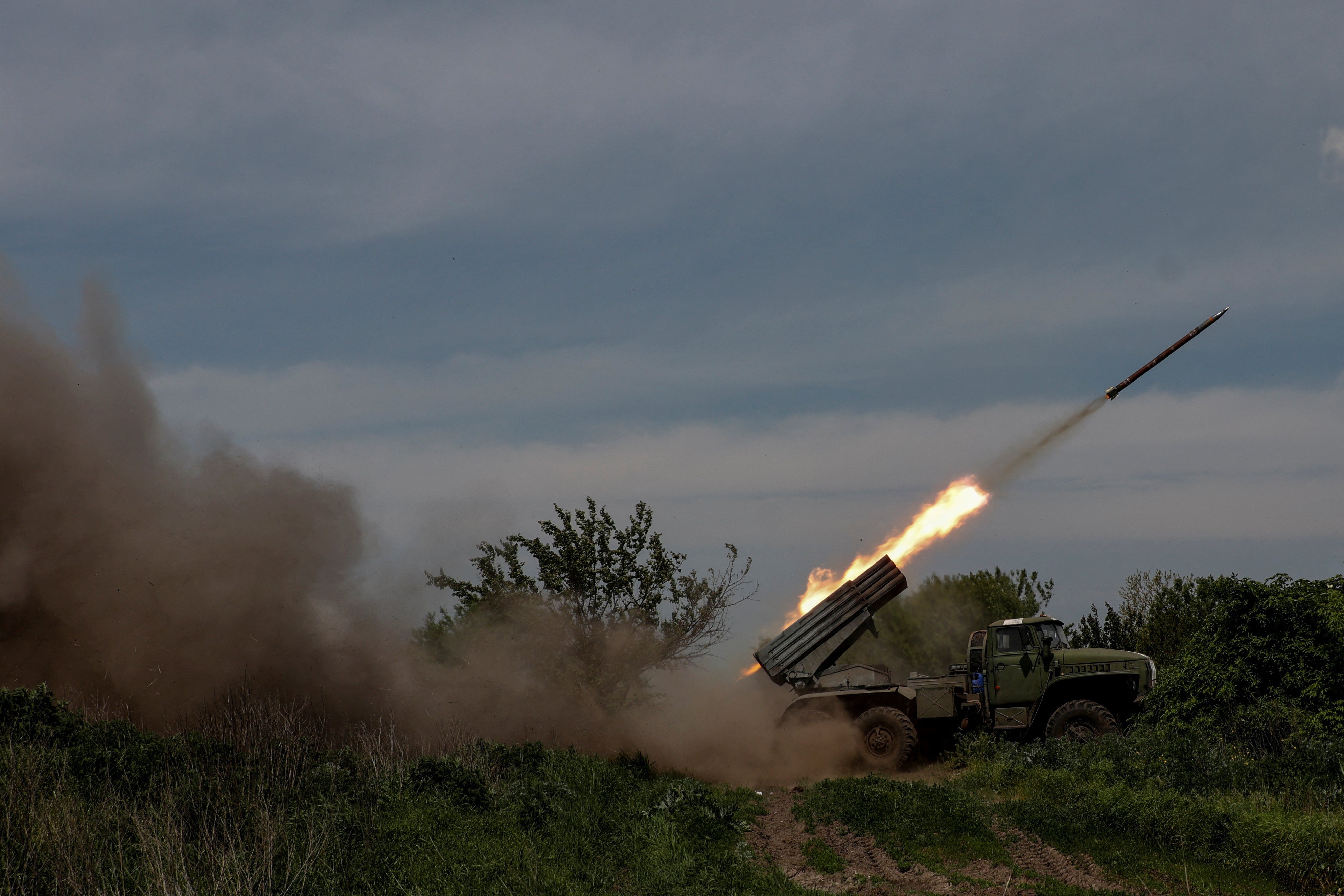 Ukrainian servicemen fire a BM-21 Grad multiple launch rocket system towards Russian troops, amid Russia's attack on Ukraine, near the frontline town of Bakhmut