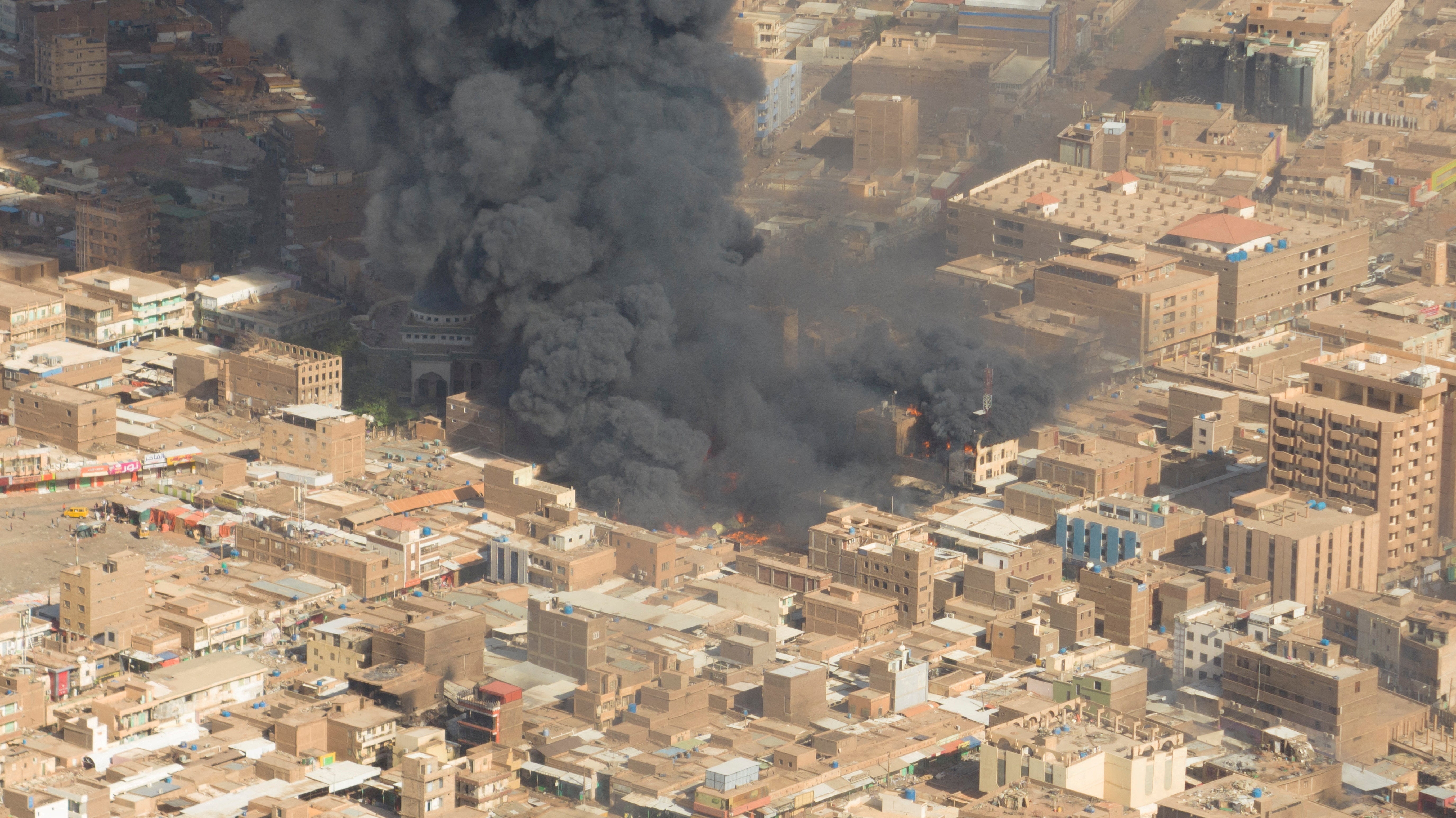 A screen grab shows black smoke and fire at Omdurman market in Omdurman, Sudan