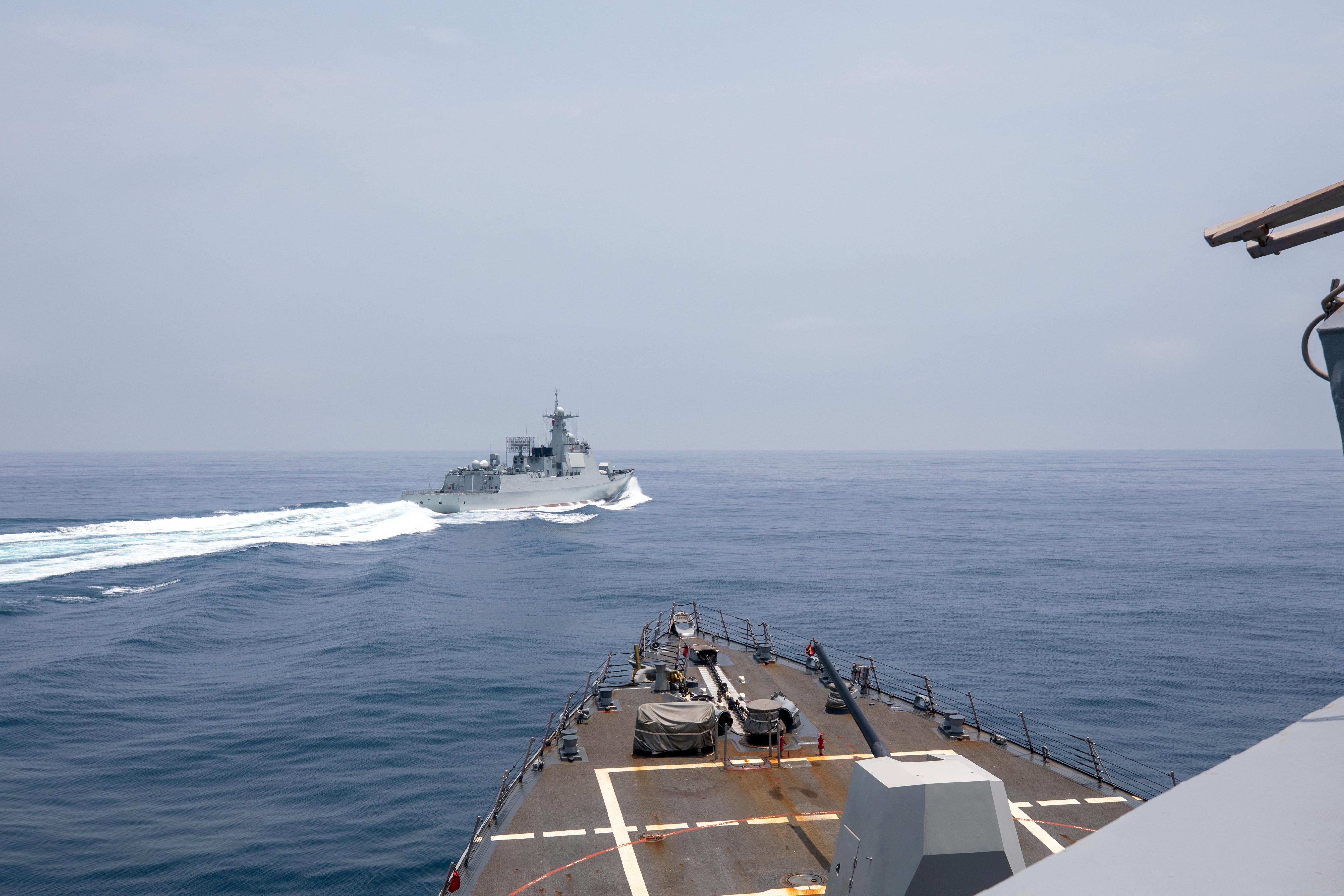 Chinese warship Luyang III sails near the U.S. destroyer USS Chung-Hoon, as seen from the deck of U.S. destroyer, in the Taiwan Strait