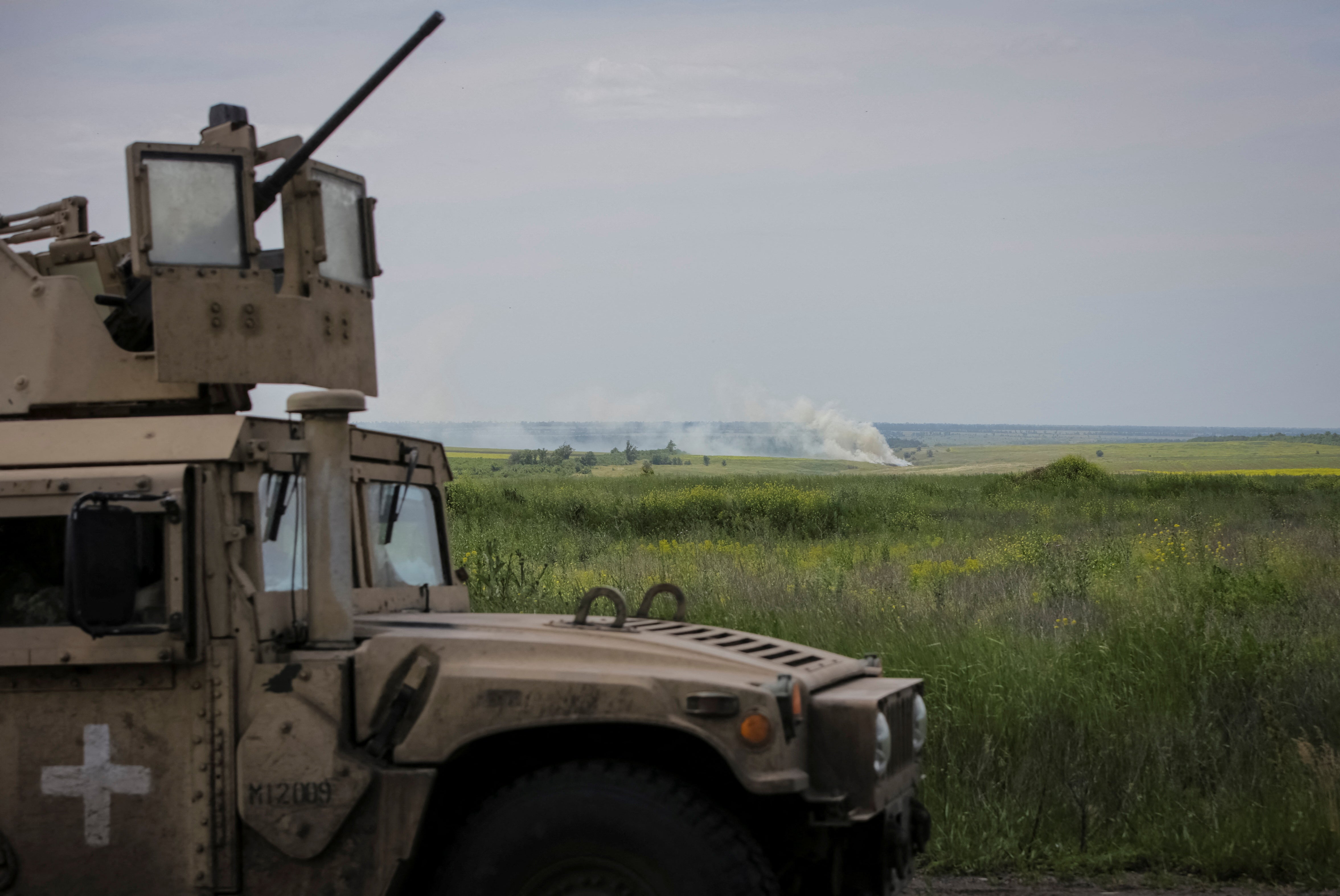 Ukrainian service members ride a military vehicle, amid Russia's full-scale invasion of Ukraine