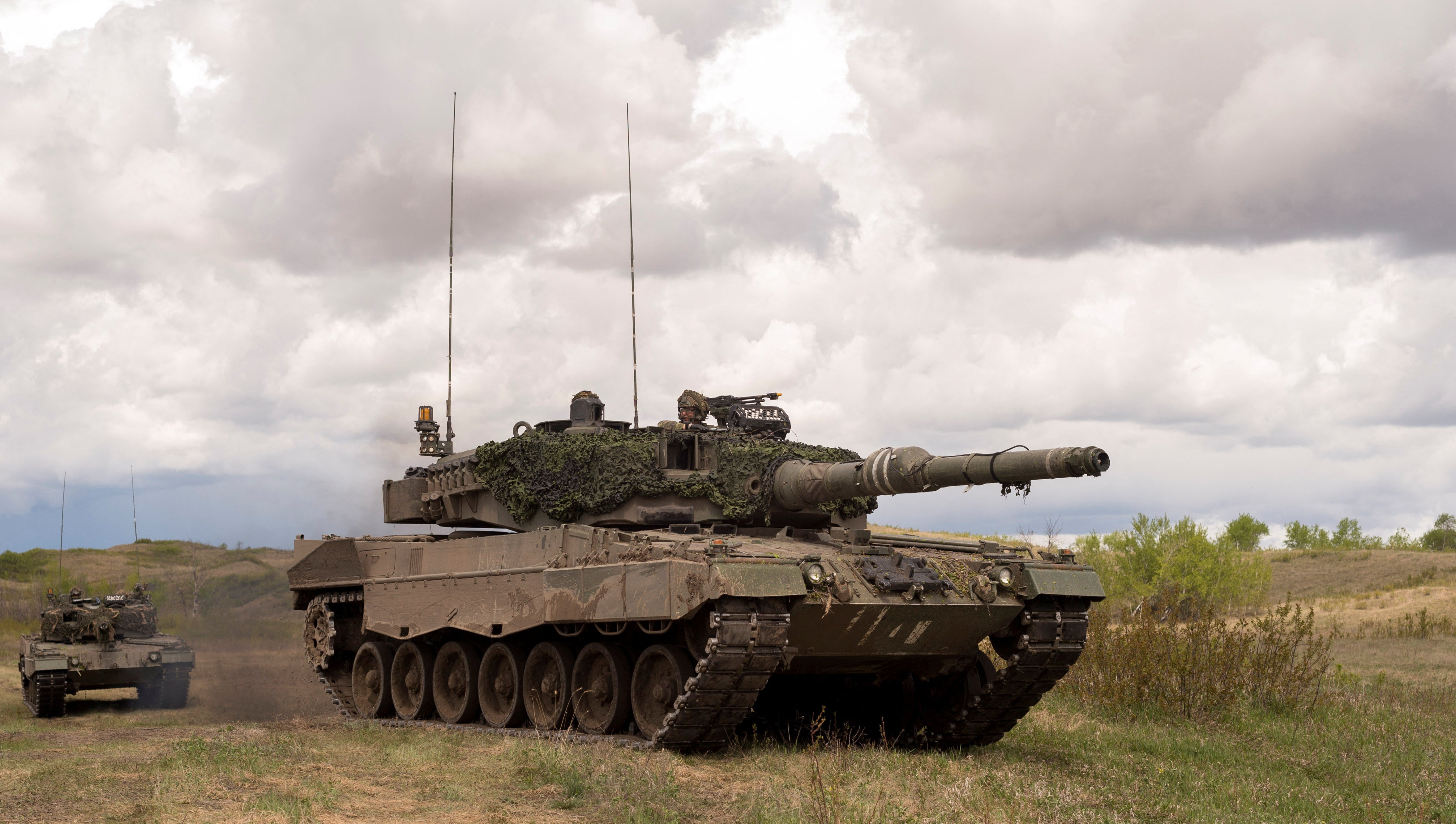 Leopard 2A4 tanks from the Royal Canadian Dragoons, C Squadron travel in the Wainwright Garrison training area