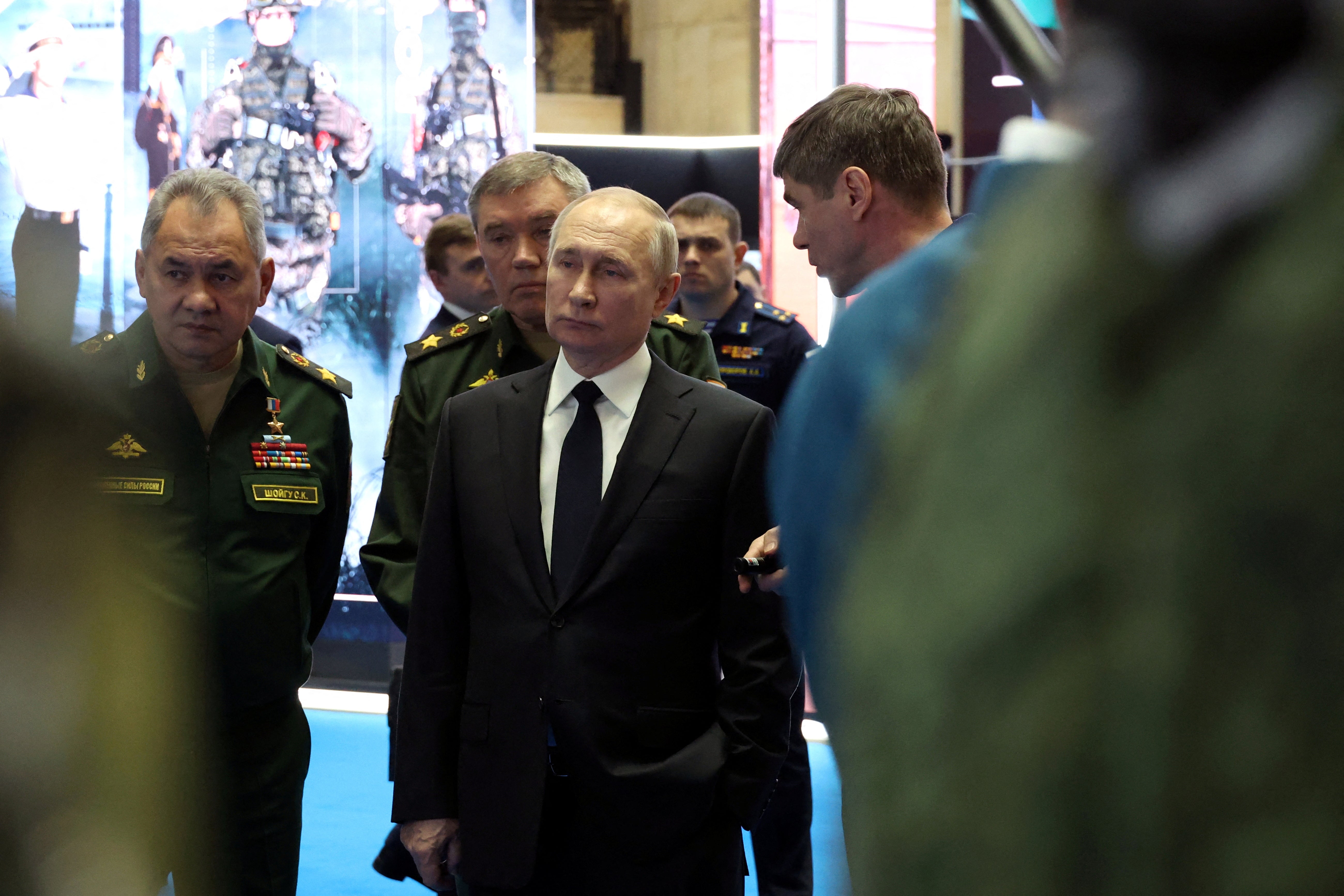 Russian President Vladimir Putin, Defence Minister Sergei Shoigu and Chief of the General Staff of Russian Armed Forces