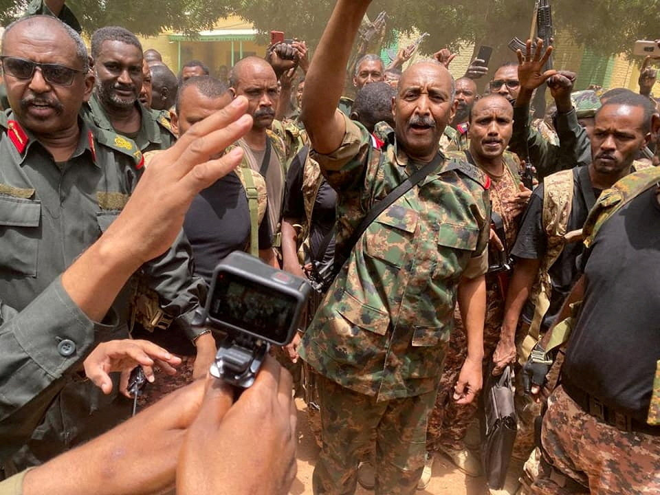 Sudan army chief Burhan appearing to leave army HQ for first time since war began, video shows