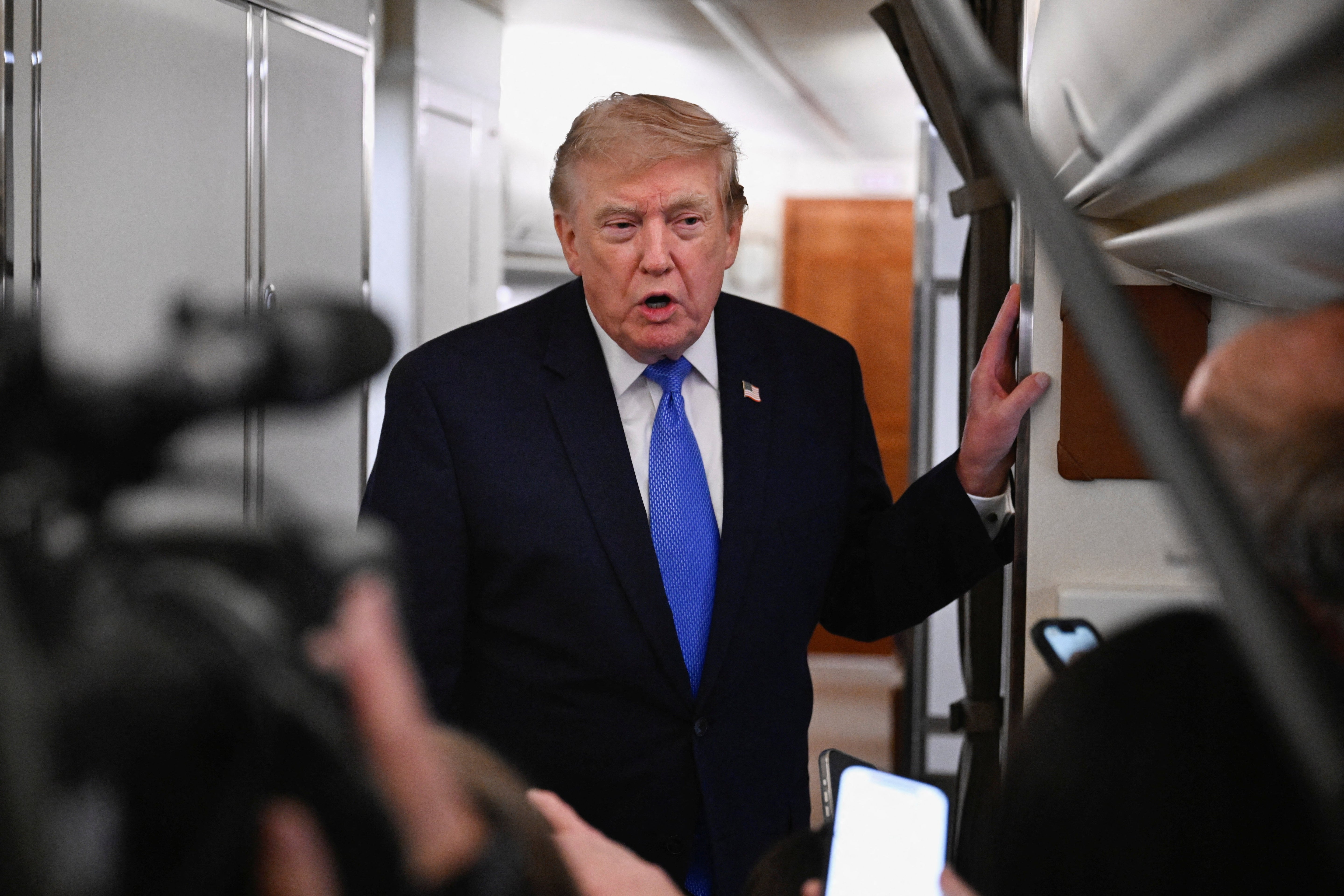 FILE PHOTO: U.S. President Donald Trump speaks to the media aboard Air Force One en route to Joint Base Andrews, in Maryland, U.S., August 2, 2026. REUTERS/Daniel Heuer/File Photo