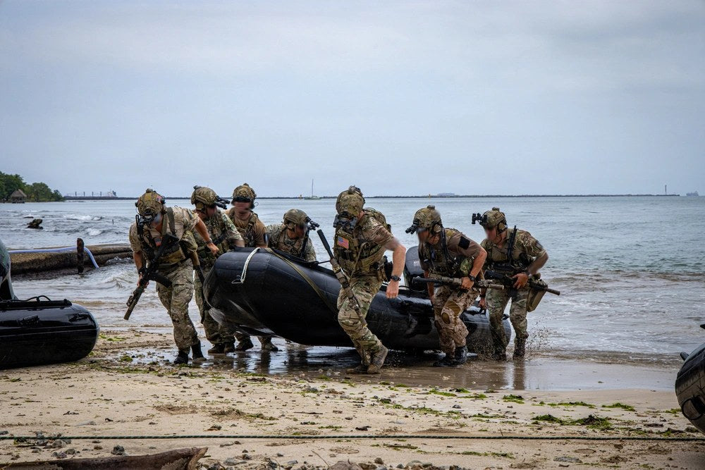 U.S. East Coast-based Naval Special Warfare operators carry a combat rubber raiding craft onto a beach during PANAMAX 2026 in Colón Province, Panama, on Aug. 5, 2026. U.S. Army photo by Sgt. Travis Denny.