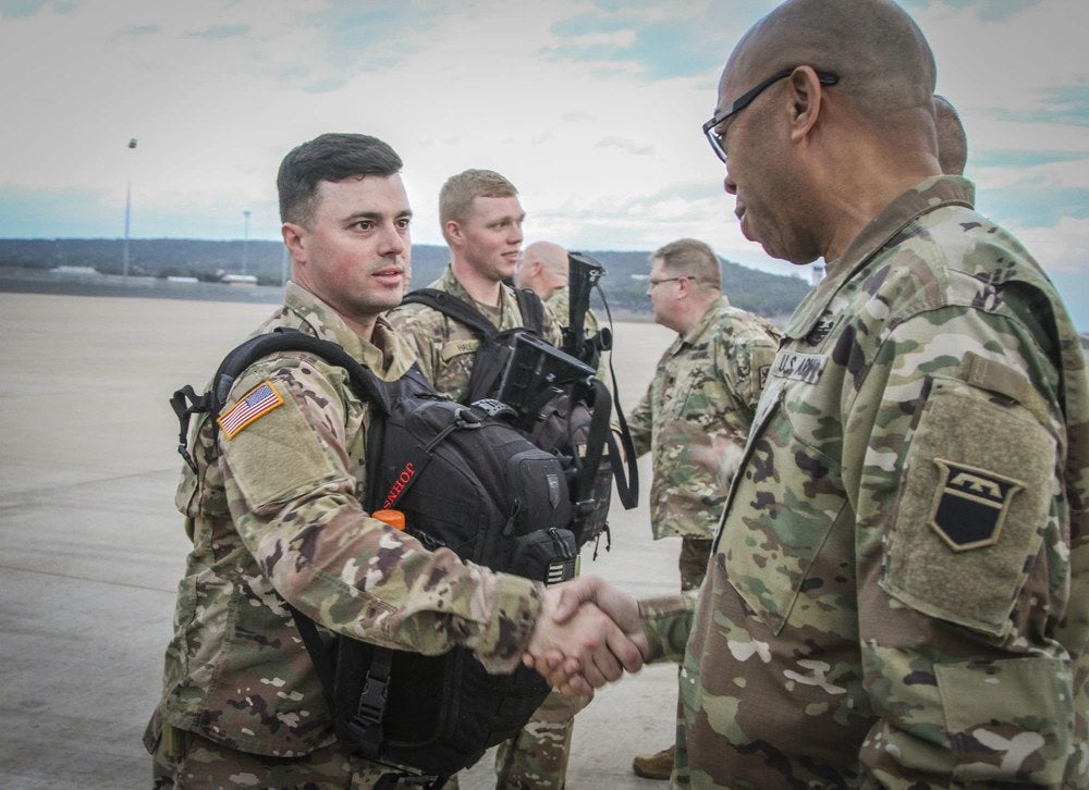 U.S. Army Reserve soldiers prepare for an overseas deployment. A new lawsuit argues federal agencies are still applying outdated rules when determining differential pay for some mobilized federal employees who also serve in the Reserve.