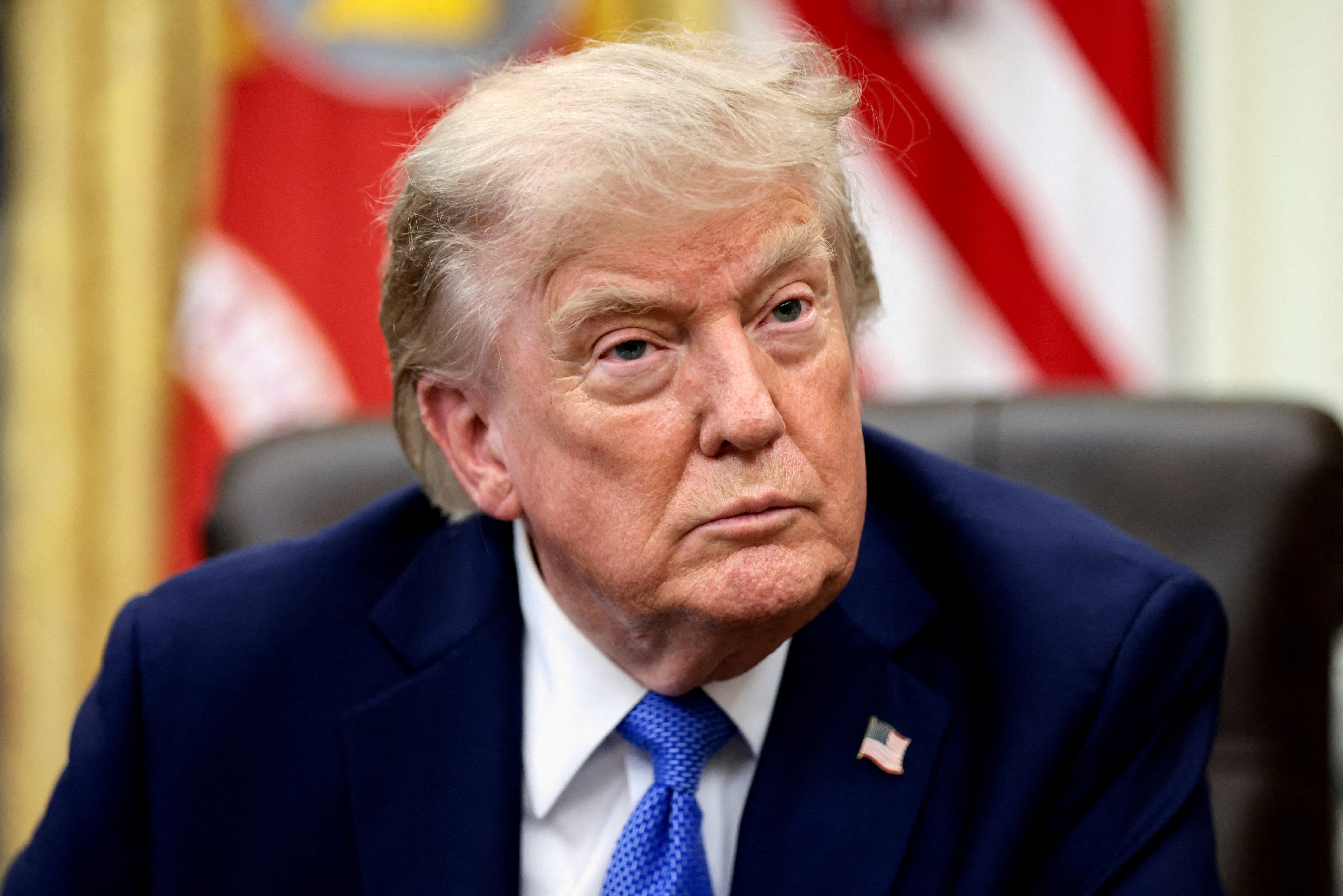 FILE PHOTO: U.S. President Donald Trump attends an event to sign executive orders related to birthright citizenship and the polysilicon industry, in the Oval Office at the White House in Washington, D.C., U.S., August 6, 2026. REUTERS/Evelyn