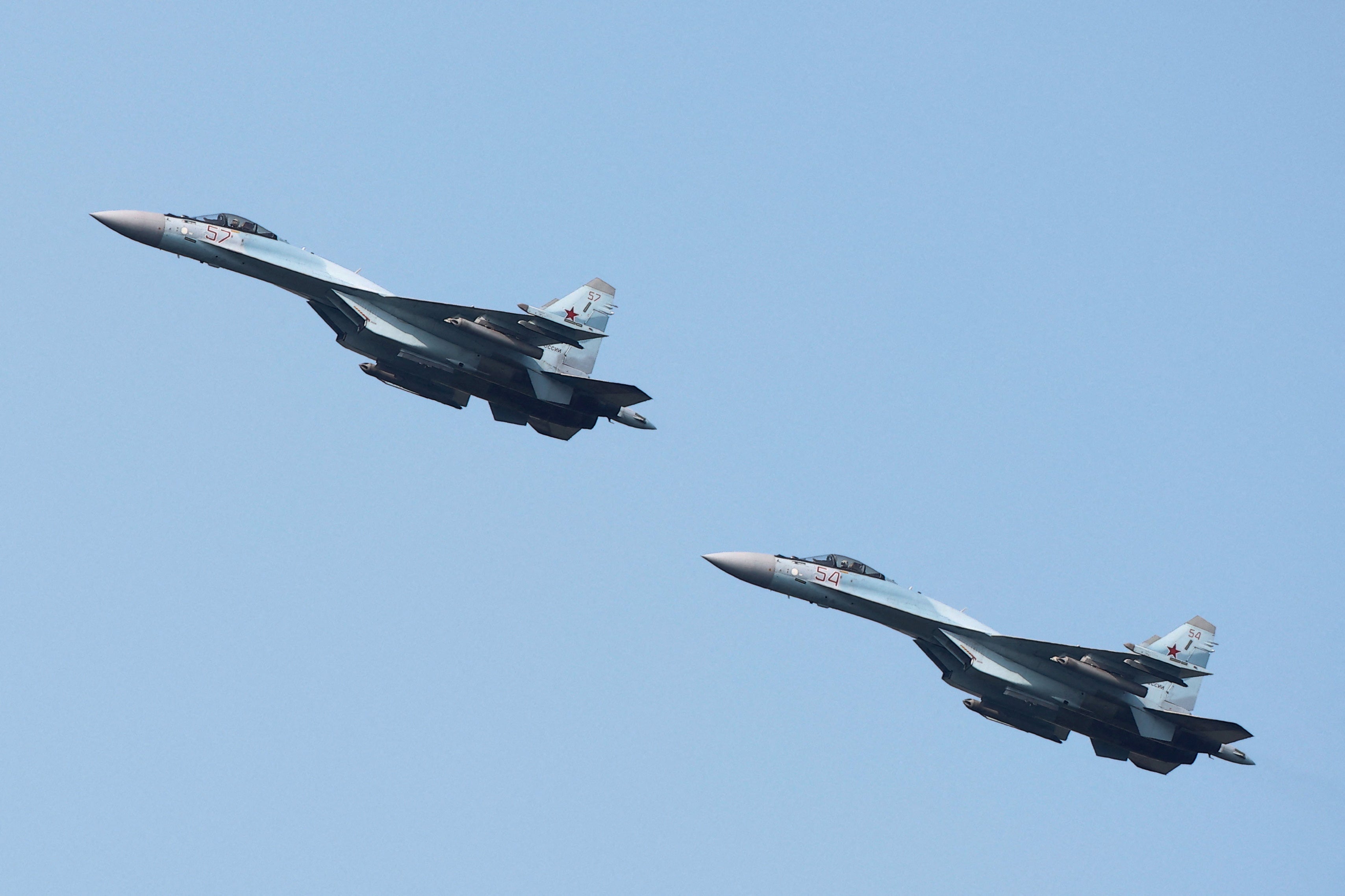 Russian Sukhoi Su-35 jet fighters perform a flight during the Aviadarts competition