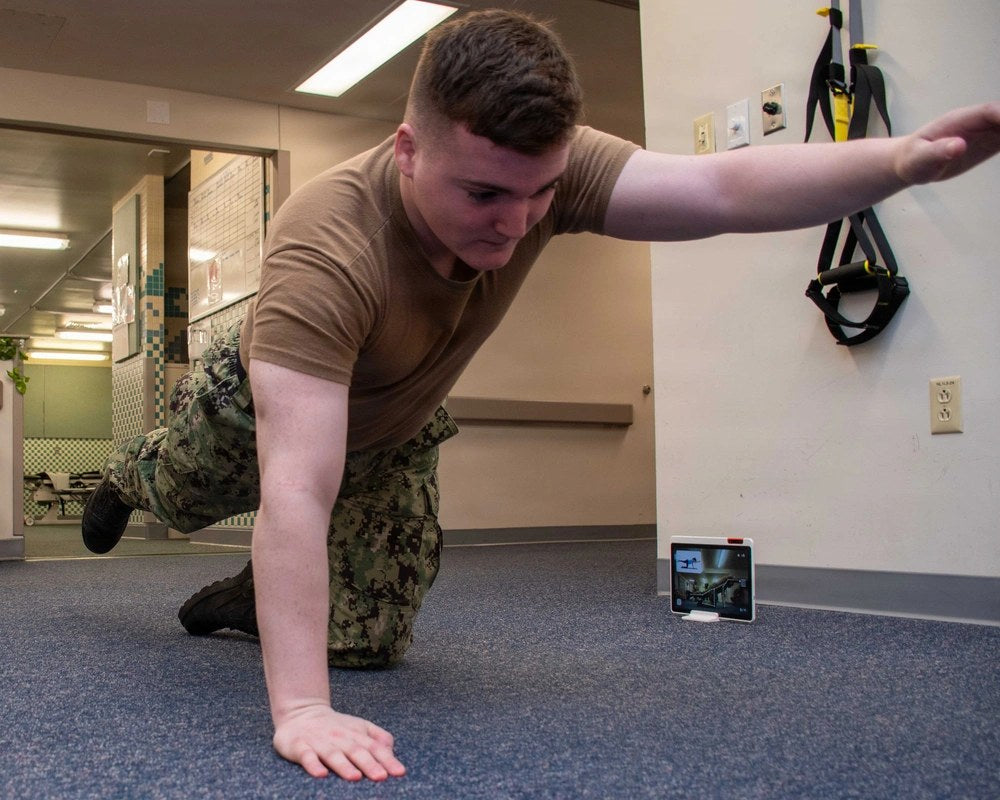 U.S. Navy personnel participate in a physical therapy exercise session. U.S. Navy photo / DVIDS.
