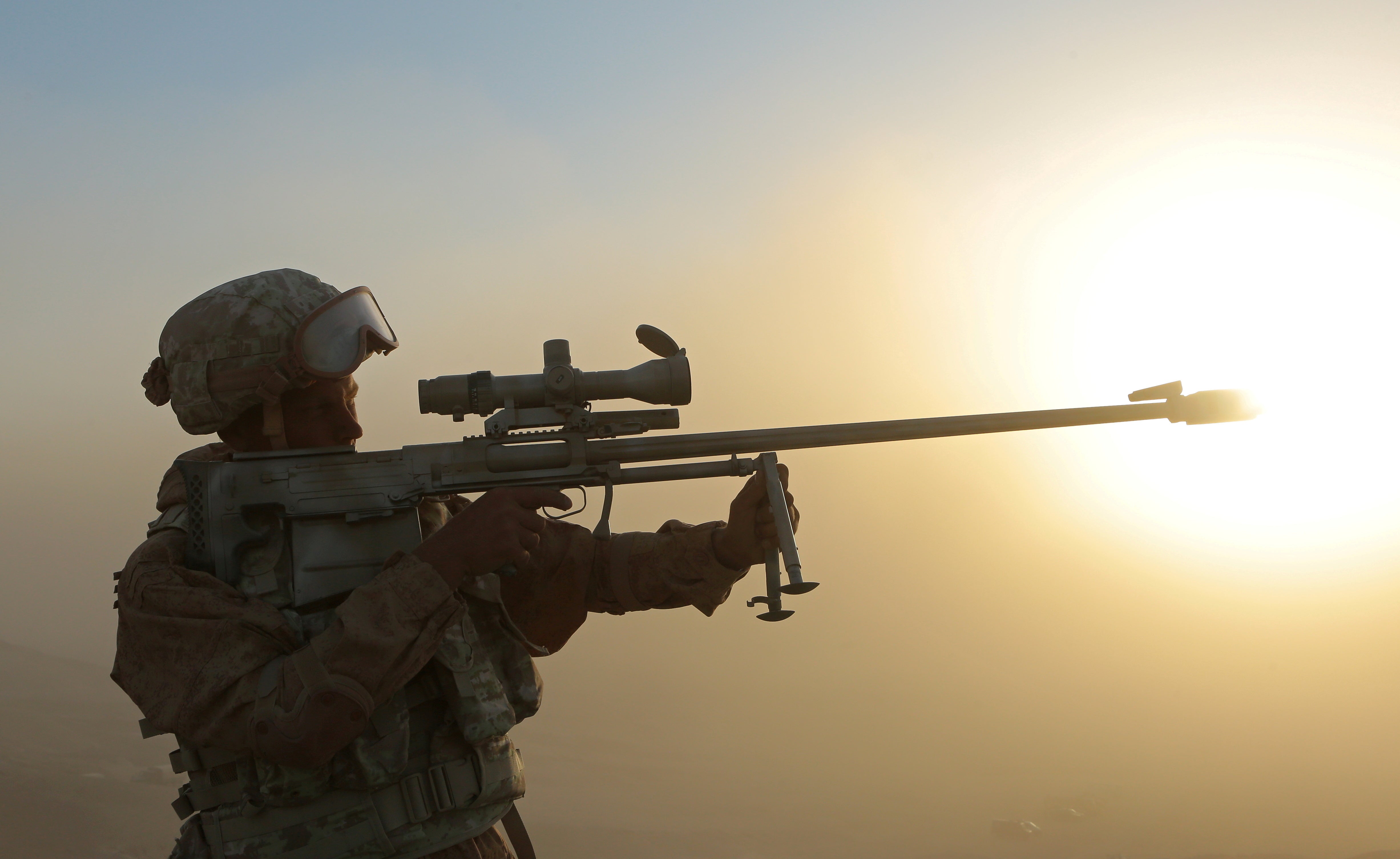 A Russian serviceman holds a sniper rifle during joint military drills involving Russia, Uzbekistan and Tajikistan, at the Harb-Maidon training ground