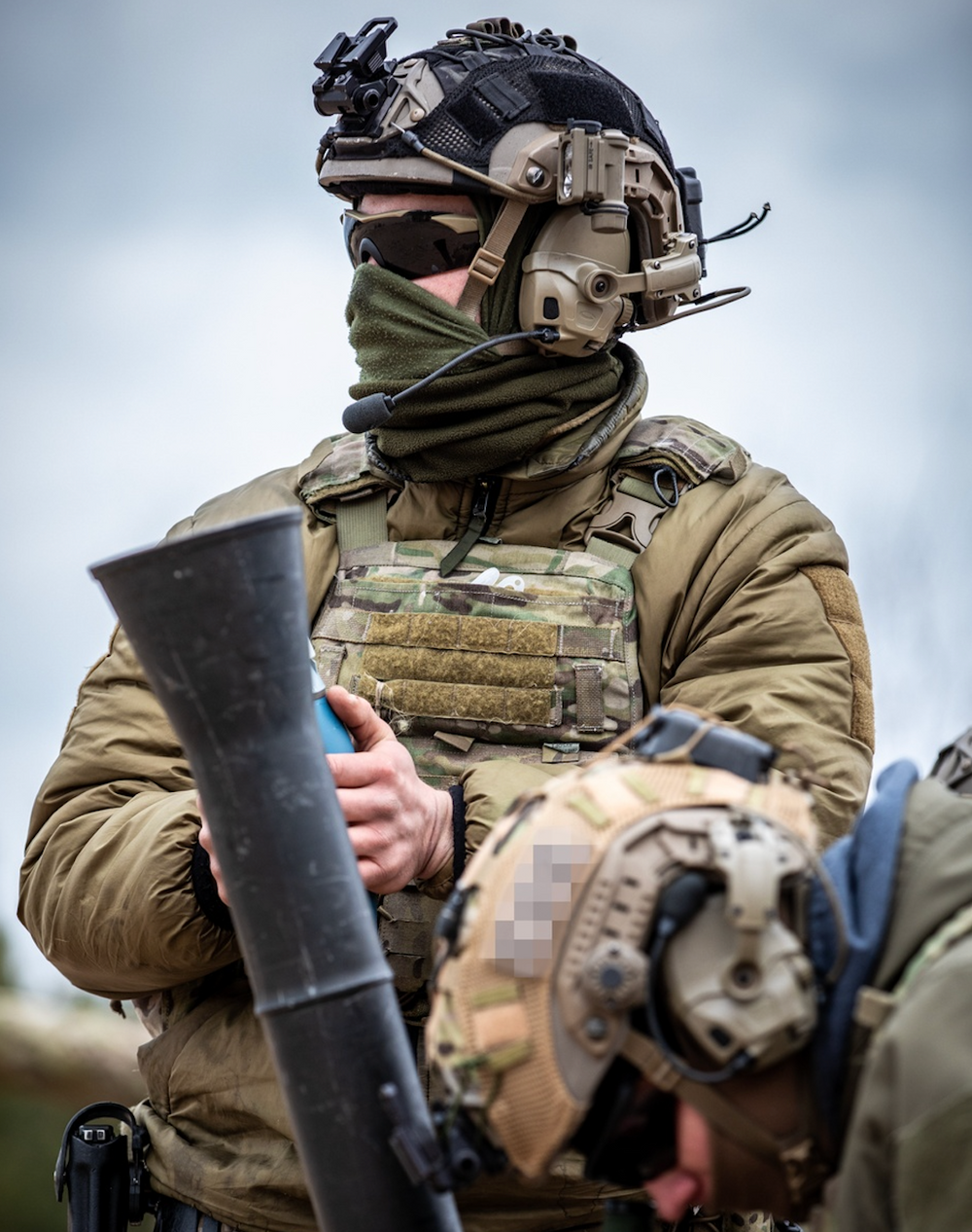 Members of the Latvian Special Operations Unit prepare to fire mortar rounds during bilateral training with U.S. Army Green Berets