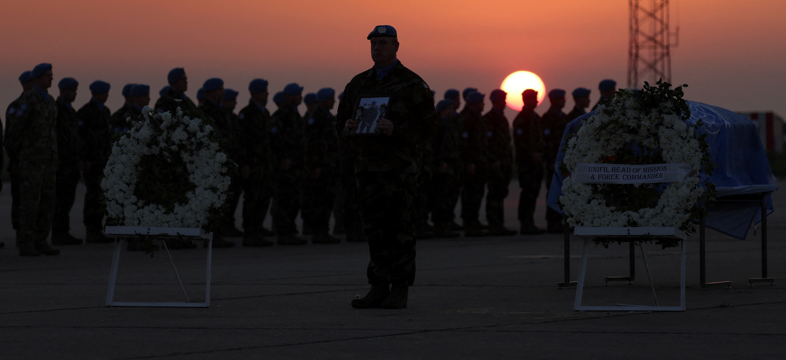 Members of the United Nations Interim Force in Lebanon (UNIFIL) peacekeeping mission attend the repatriation ceremony for Irish soldier Sean Rooney