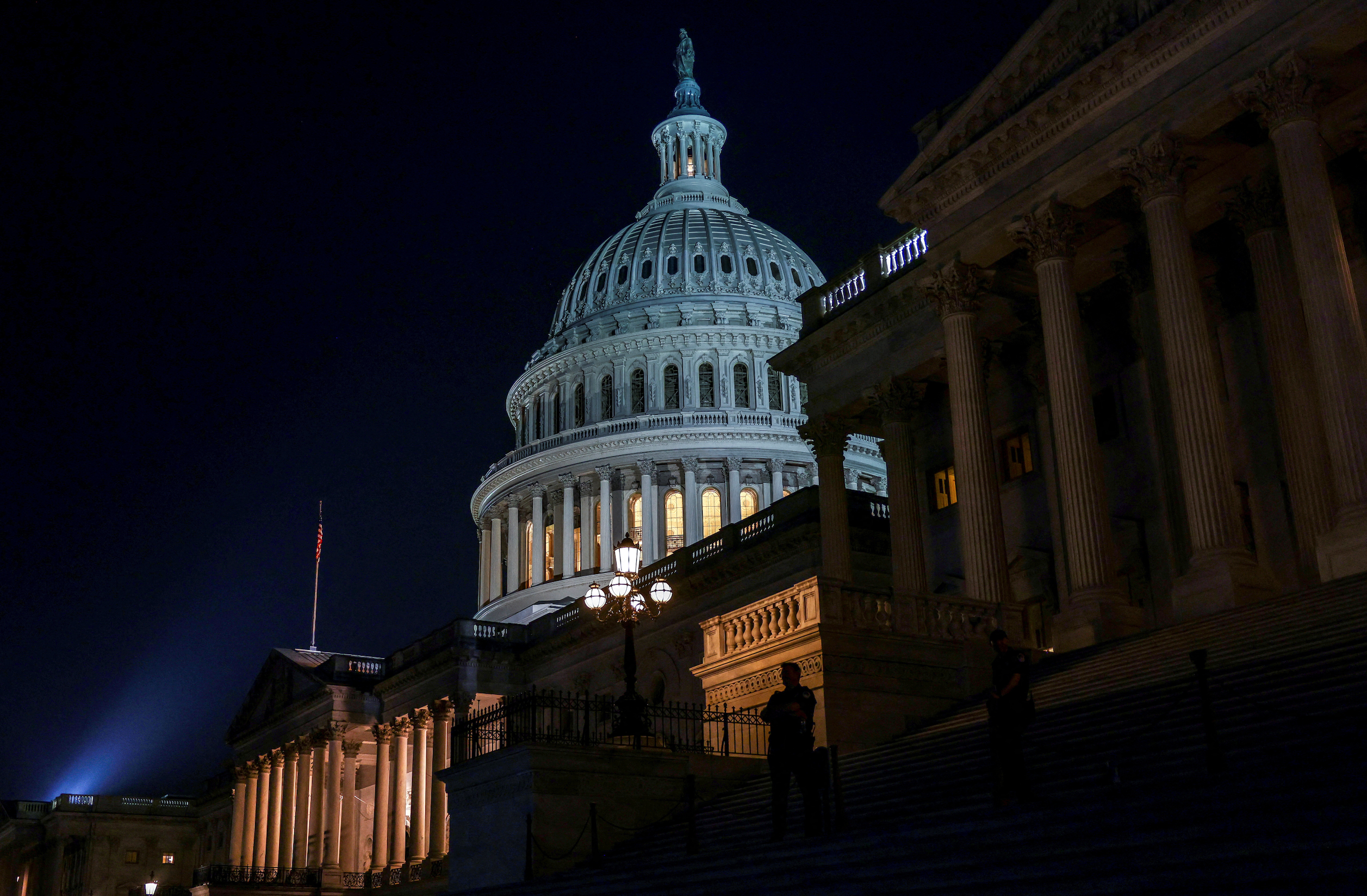 U.S. Capitol police stand outside the Capitol building as the Senate votes on debt ceiling legislation