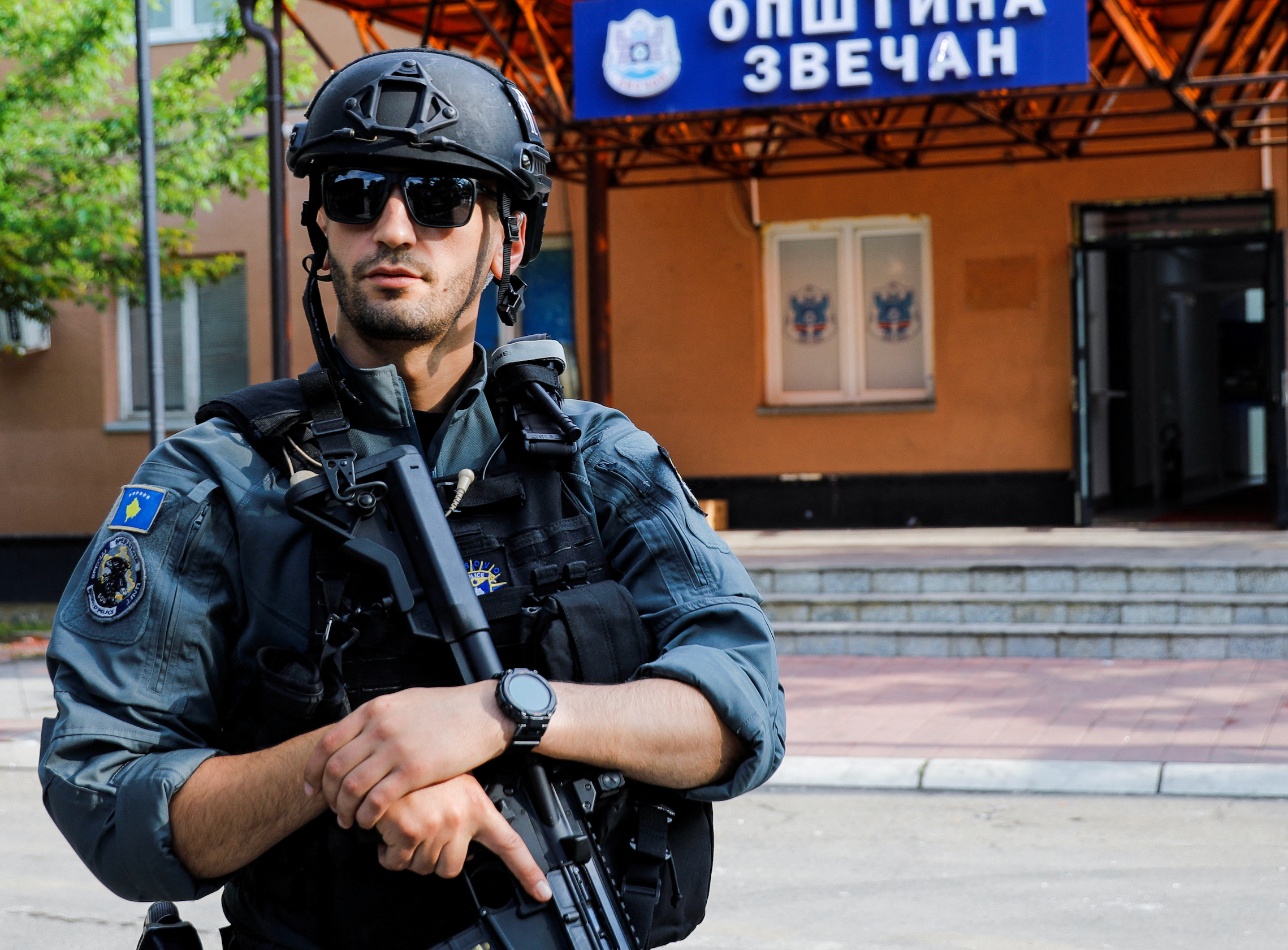 A member of Kosovo special police forces guards the municipal offices in Zvecan after ethnic Serb protestors tried to prevent a newly-elected ethnic Albanian mayor from entering the office in Zvecan, Kosovo