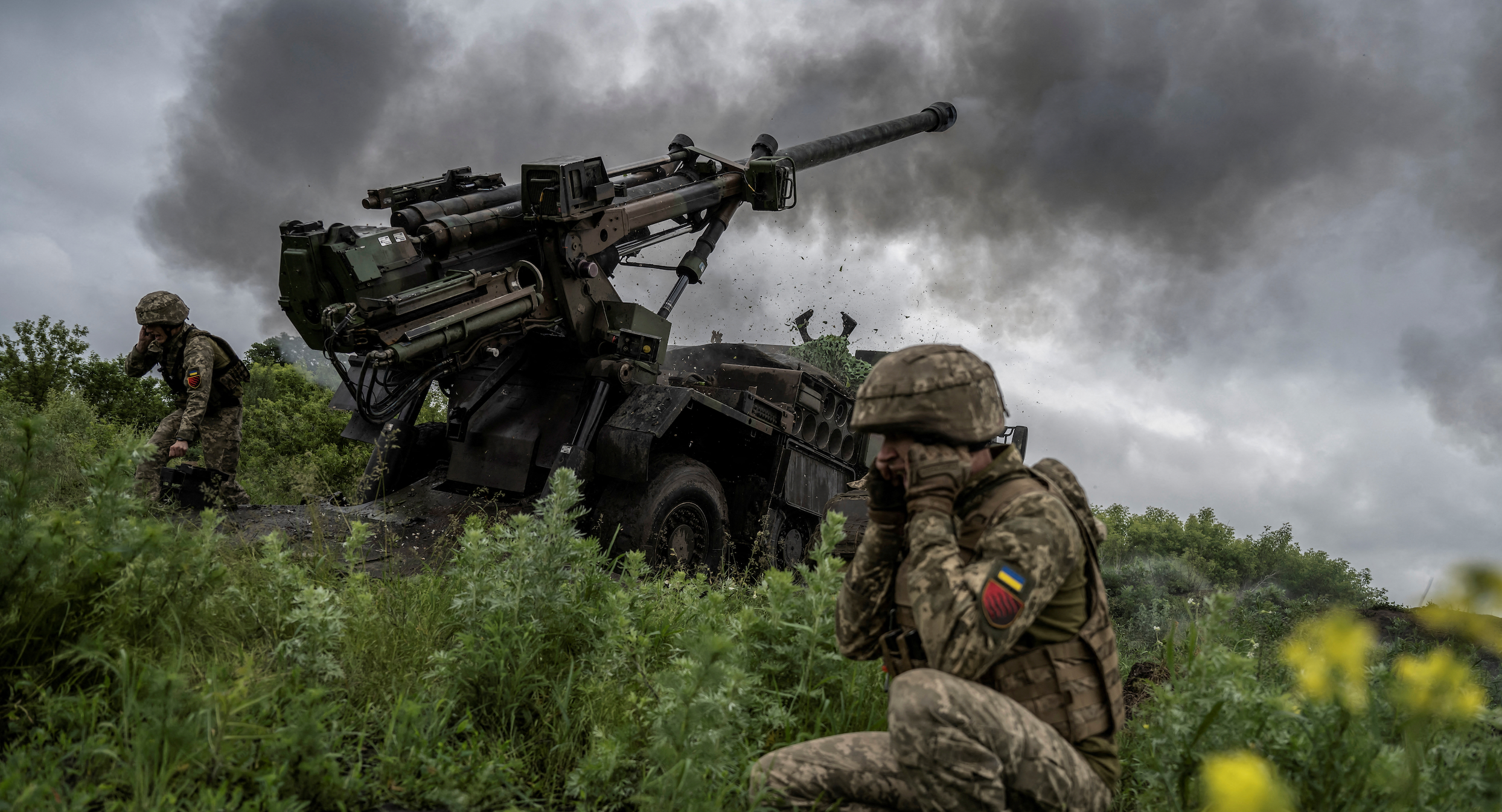 Ukrainian service members of the 55th Separate Artillery Brigade fire a Caesar self-propelled howitzer towards Russian troops, amid Russia's attack on Ukraine