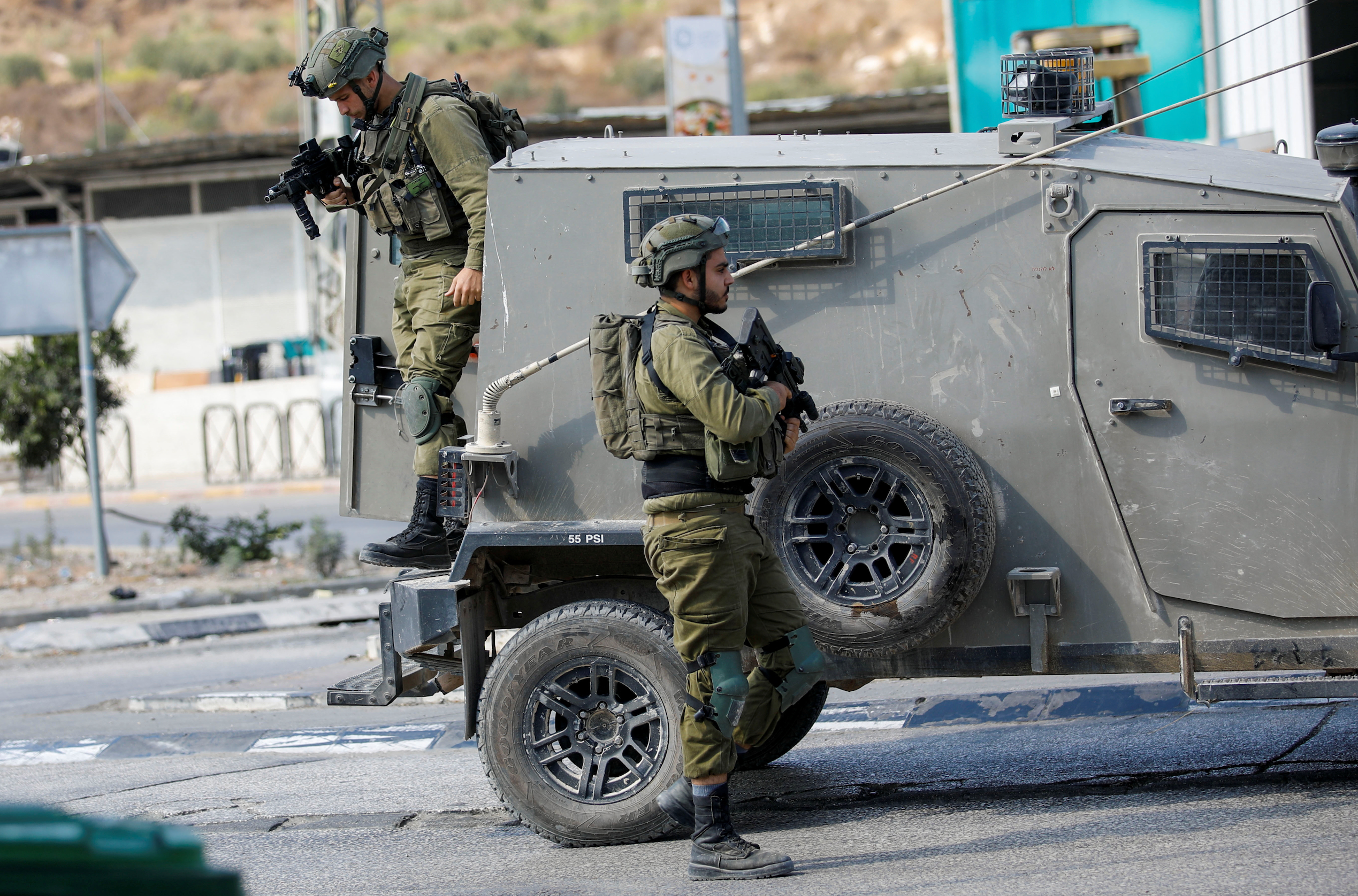 Israeli soldiers patrol near the site of a shooting incident, near Nablus in the Israeli-occupied West Bank