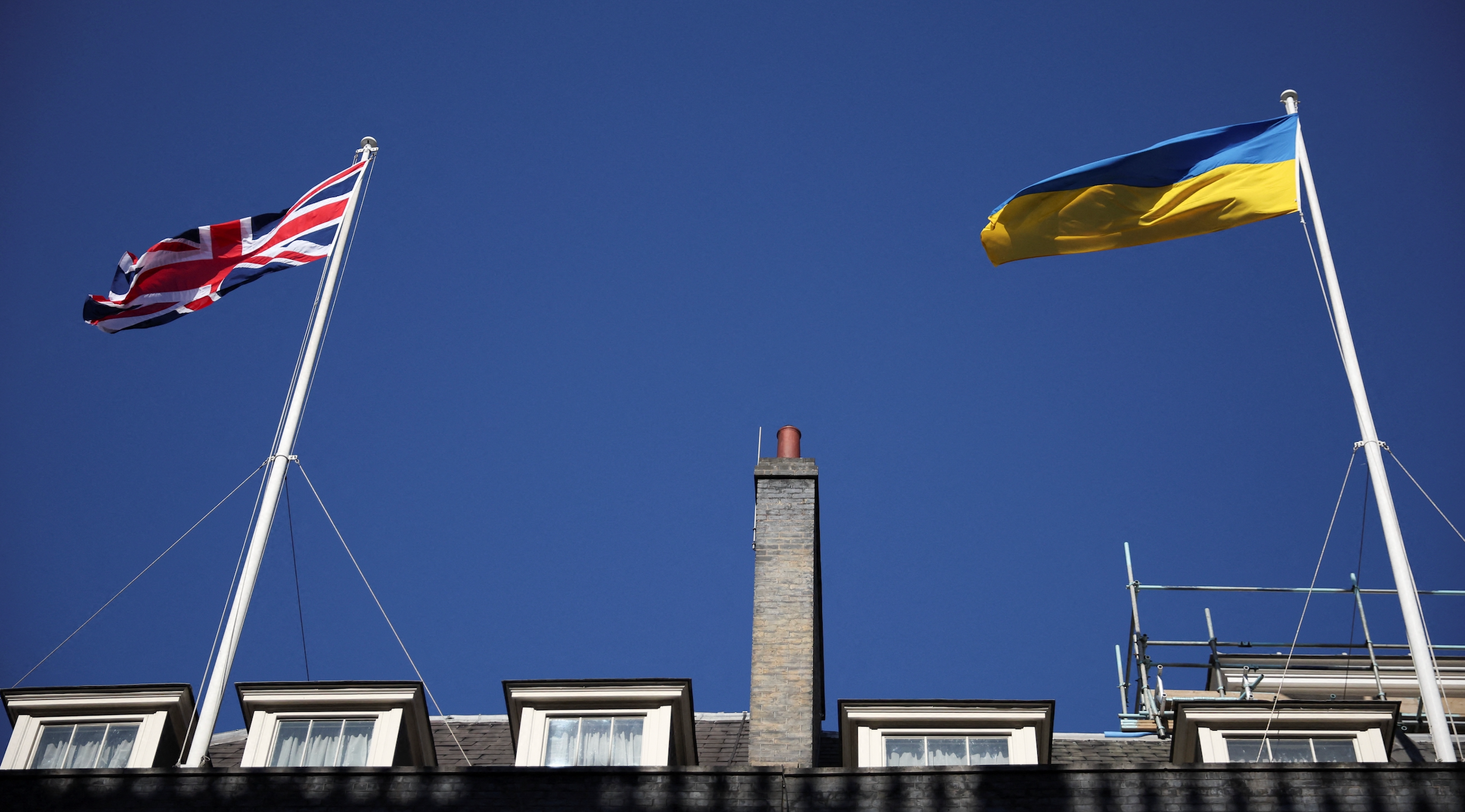The British and Ukrainian flags wave outside Downing Street, before Canadian Prime Minister Justin Trudeau