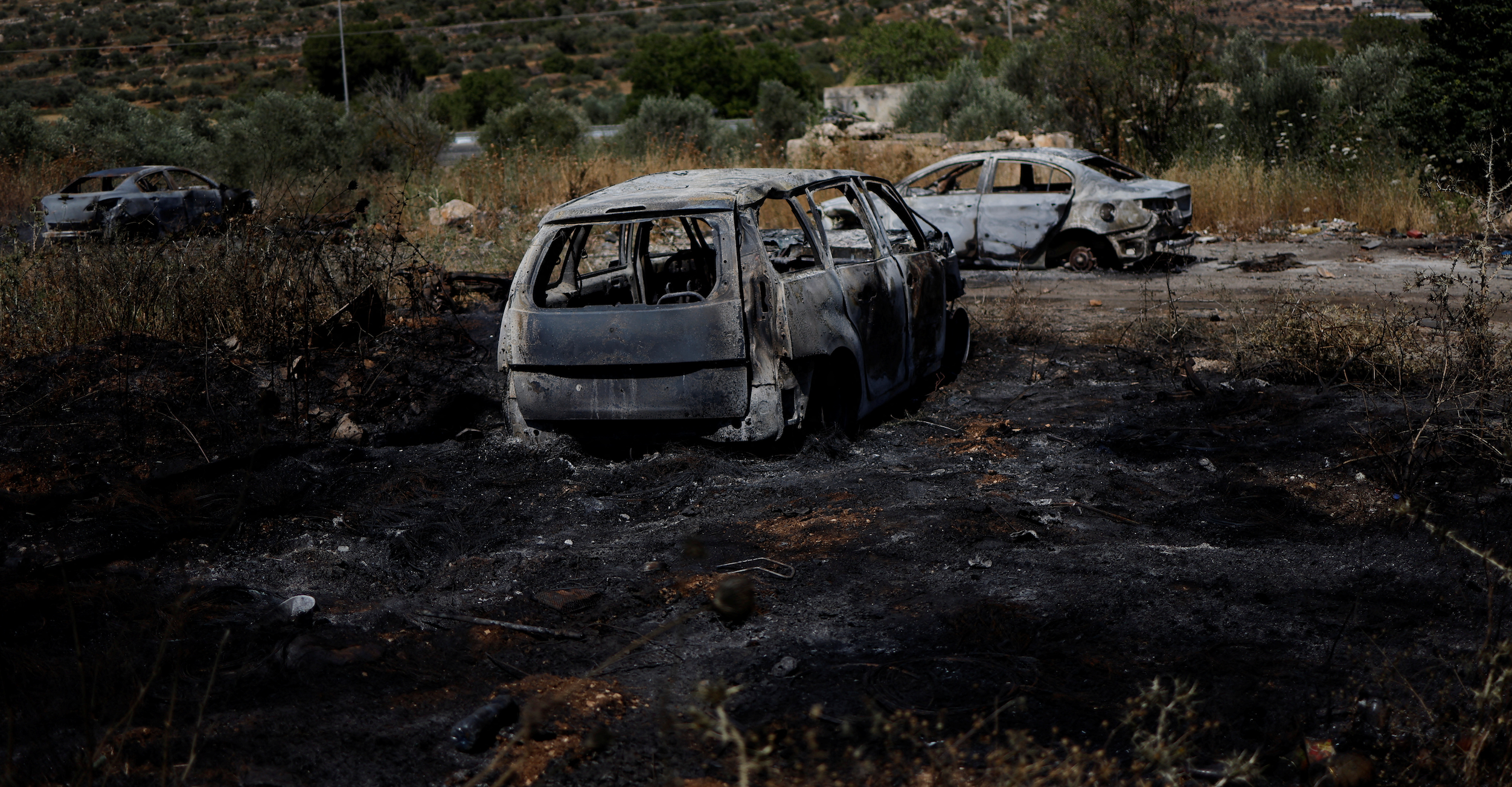 A view shows burned vehicles after an attack by Israeli settlers near Ramallah in the Israeli-occupied West Bank