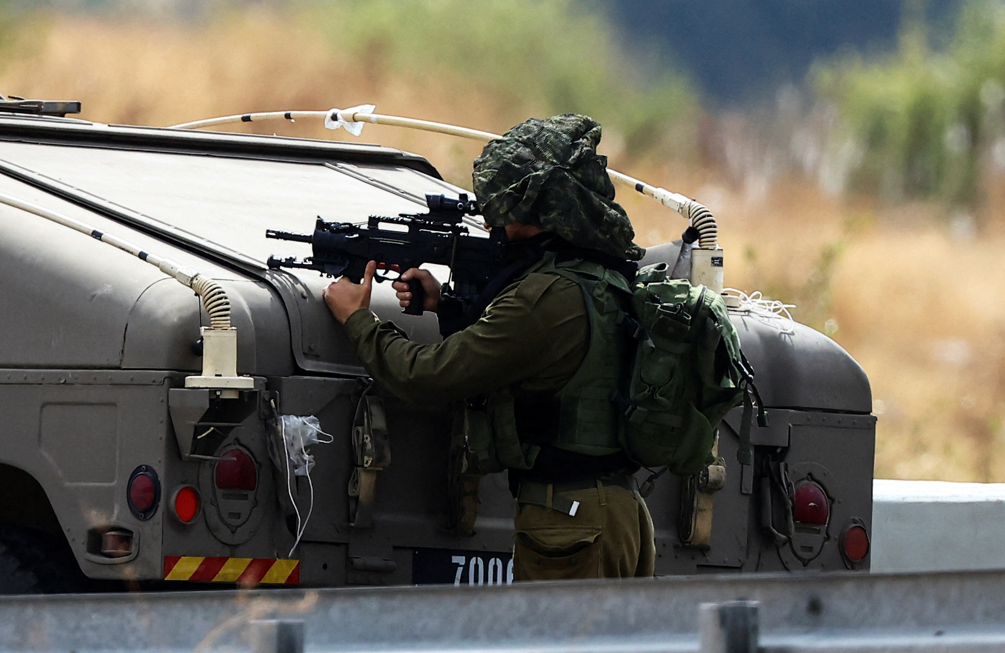 Israeli military says it killed at least 1,000 infiltrators, reinforcing nationwide