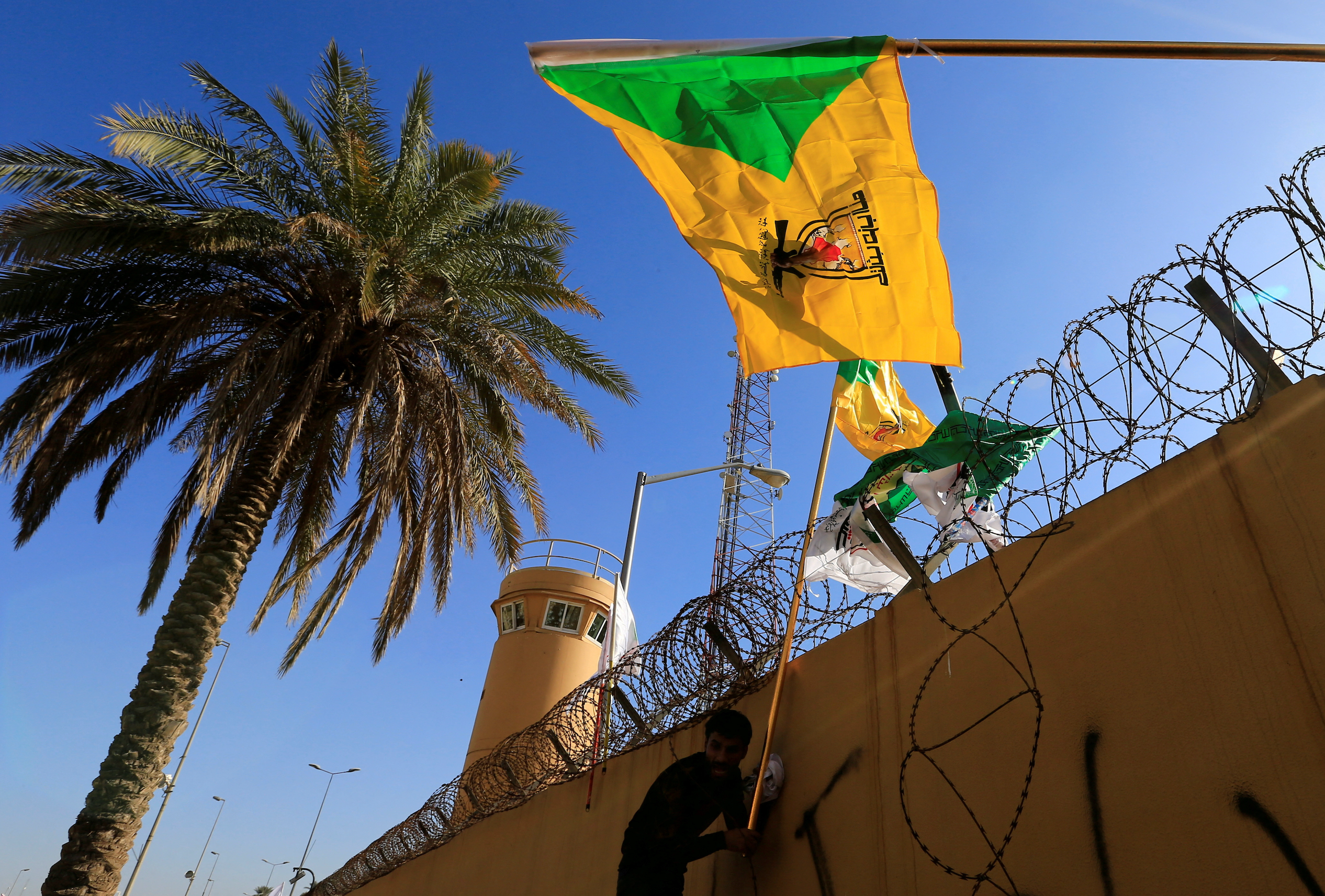 Iraq's Kataib Hezbollah says it suspends attacks on US forces