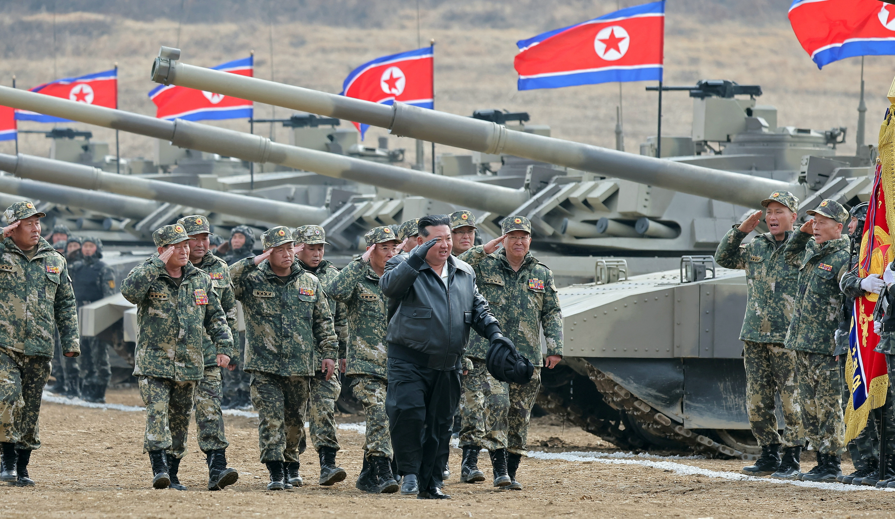 North Korea's Kim “drives” new tank during mock battle