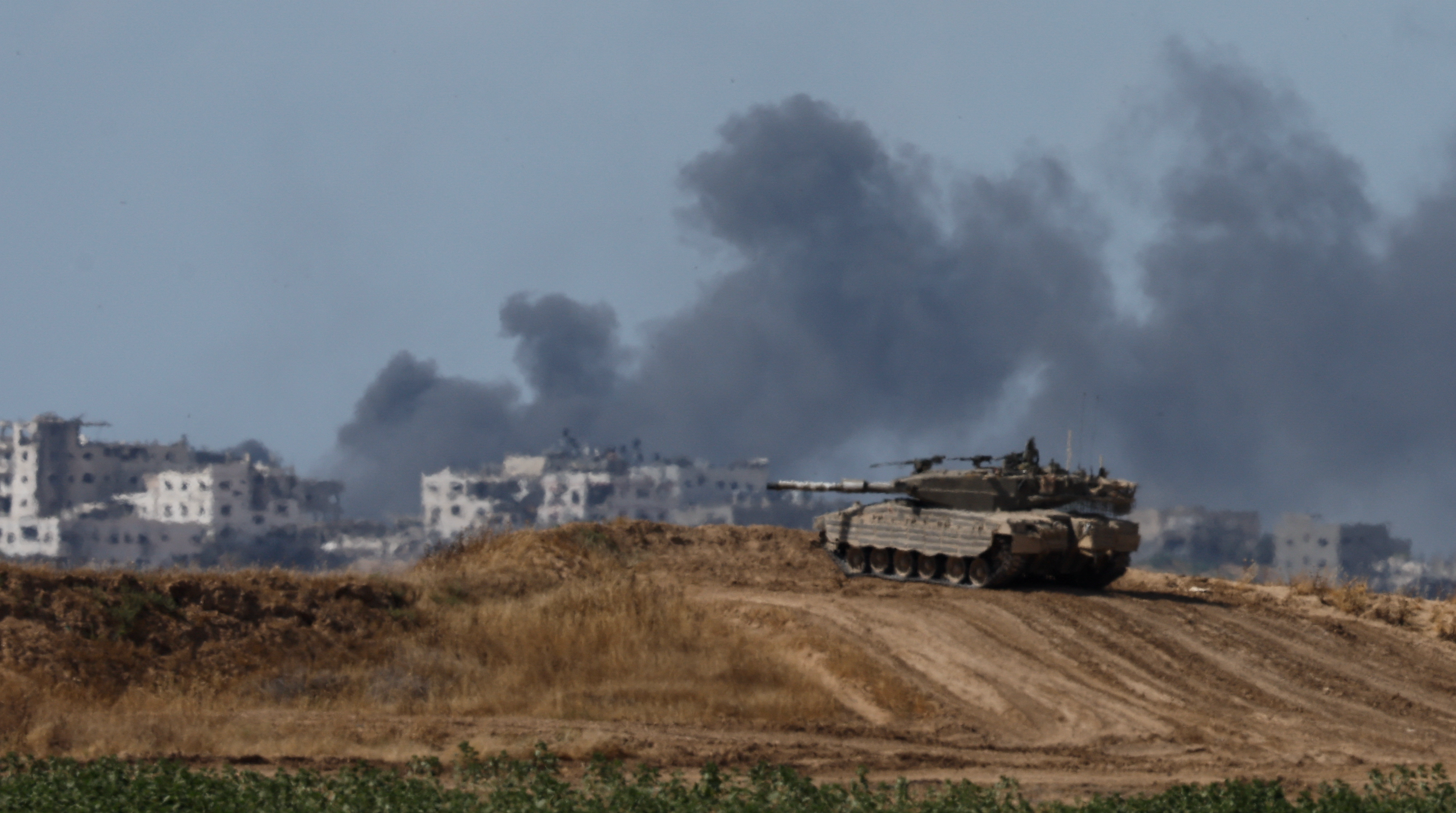 Israeli forces push into Gaza from north, south