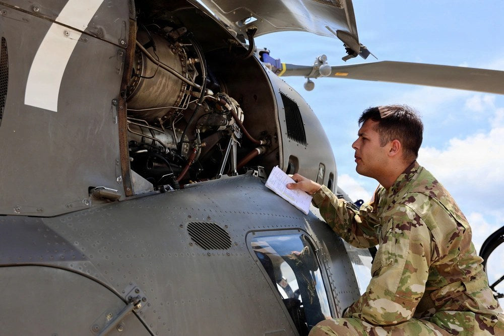 2nd Lt. Blaine Dolin, a student pilot with the 1st Battalion, 145th Aviation Regiment, inspects an LUH-72 Lakota before a solo cross-country flight near Fort Rucker, Alabama, July 10, 2026. Illustrative file photo. (U.S. Army photo by Leslie Herlick)
