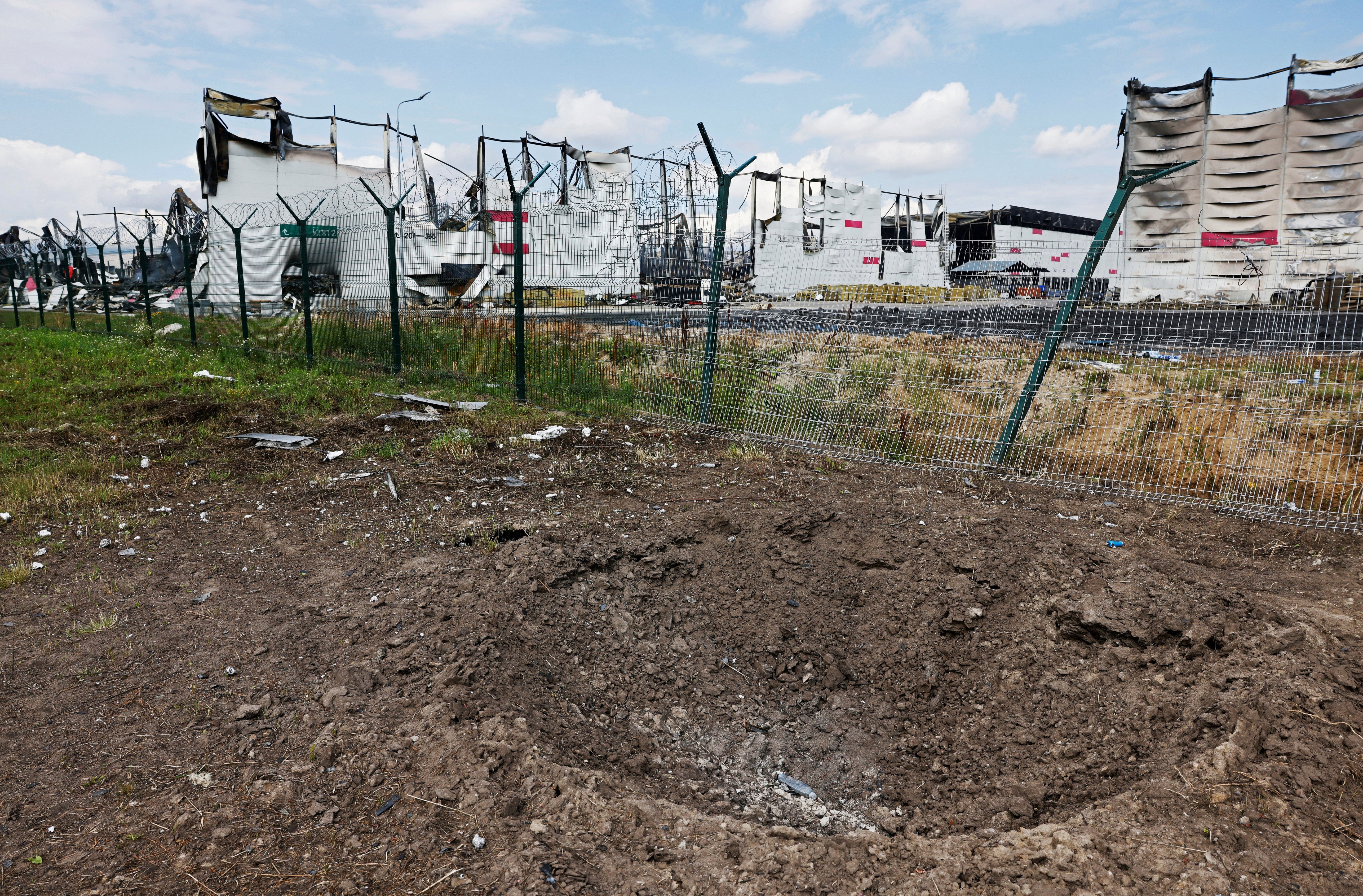 A crater near the remains of the Wildberries warehouse that burned down after a recent Ukrainian drone attack in the course of the Russia-Ukraine conflict, in the city of Elektrostal in the Moscow region, Russia July 23, 2026. REUTERS/Stringer